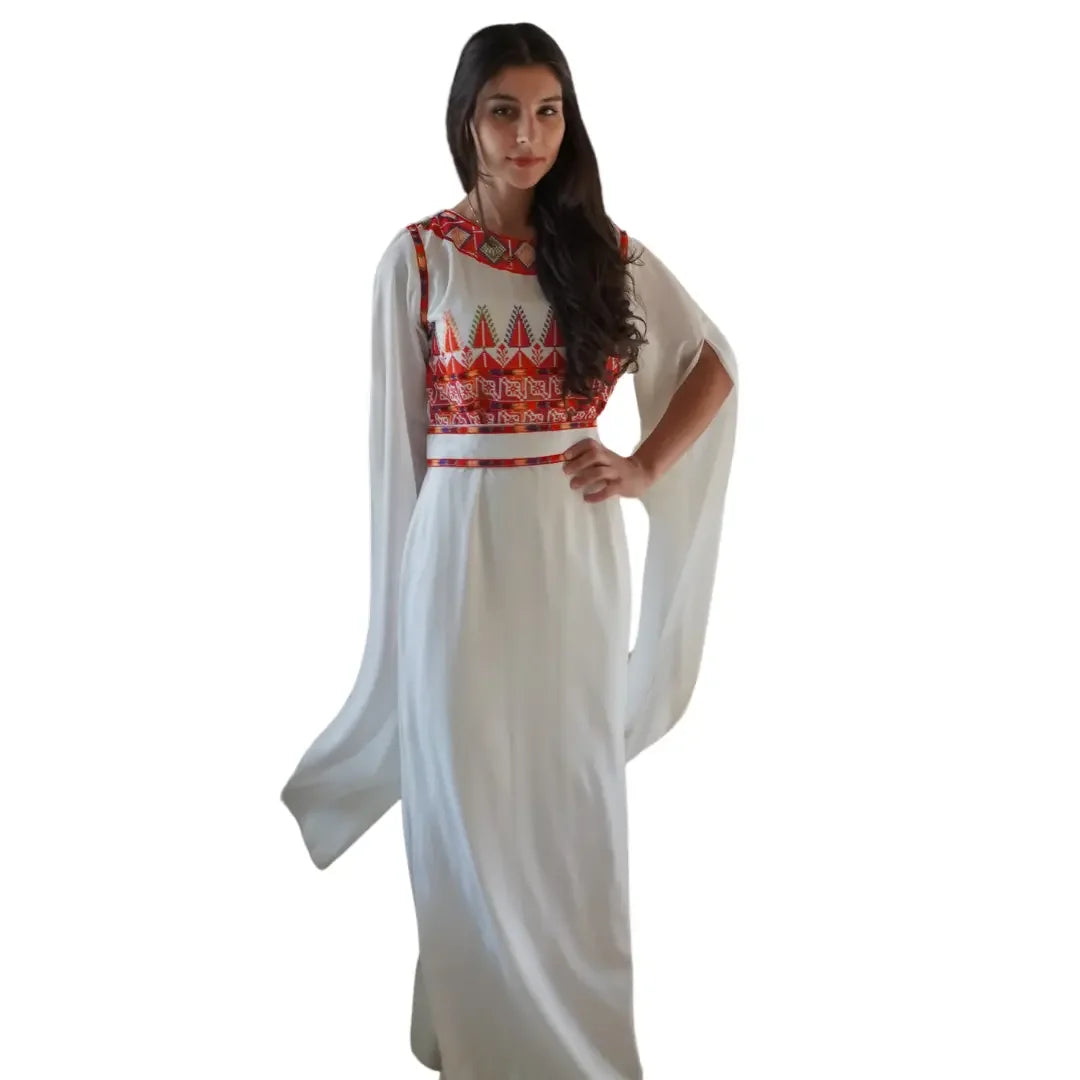 Palestinian embroidery dress in white with intricate red traditional embroidered patterns and flowing sleeves