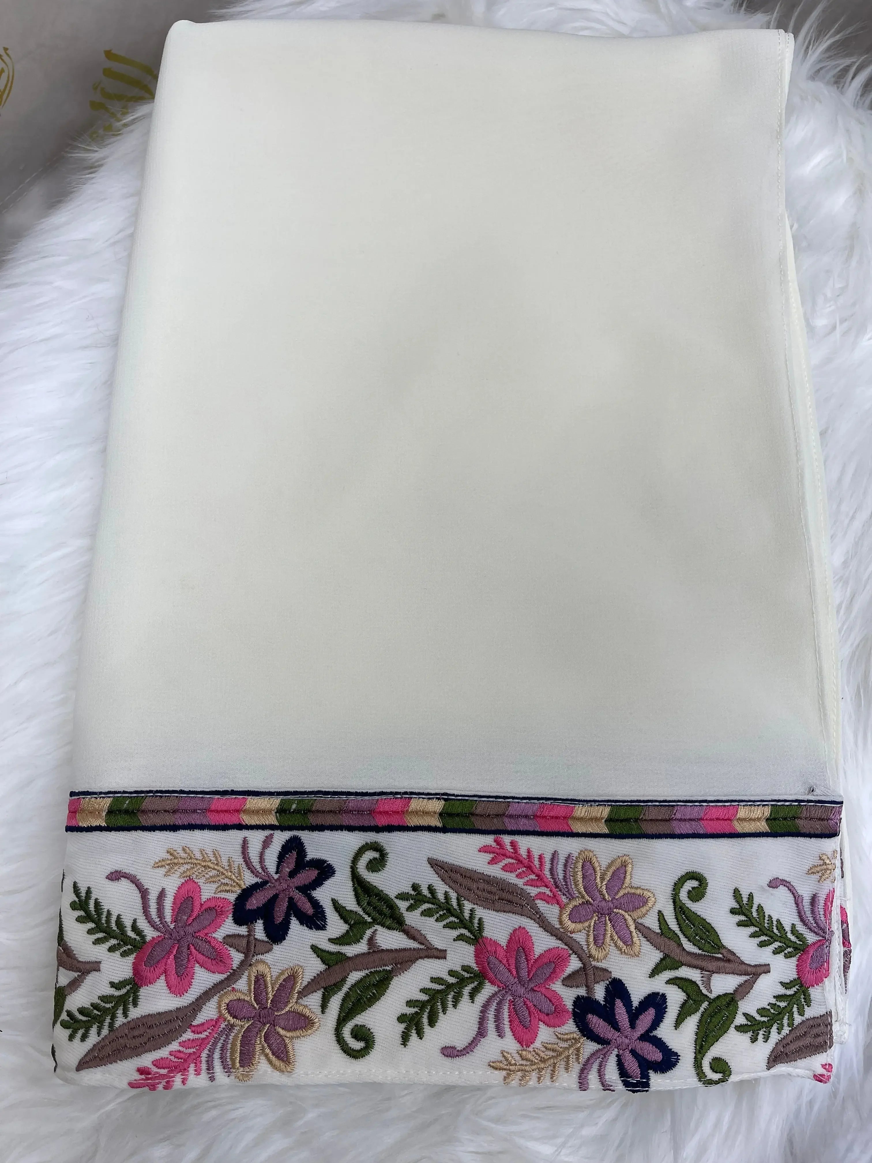 White shawl with colorful floral embroidery border by Palestinian Elegance featuring Palestinian embroidery khirka