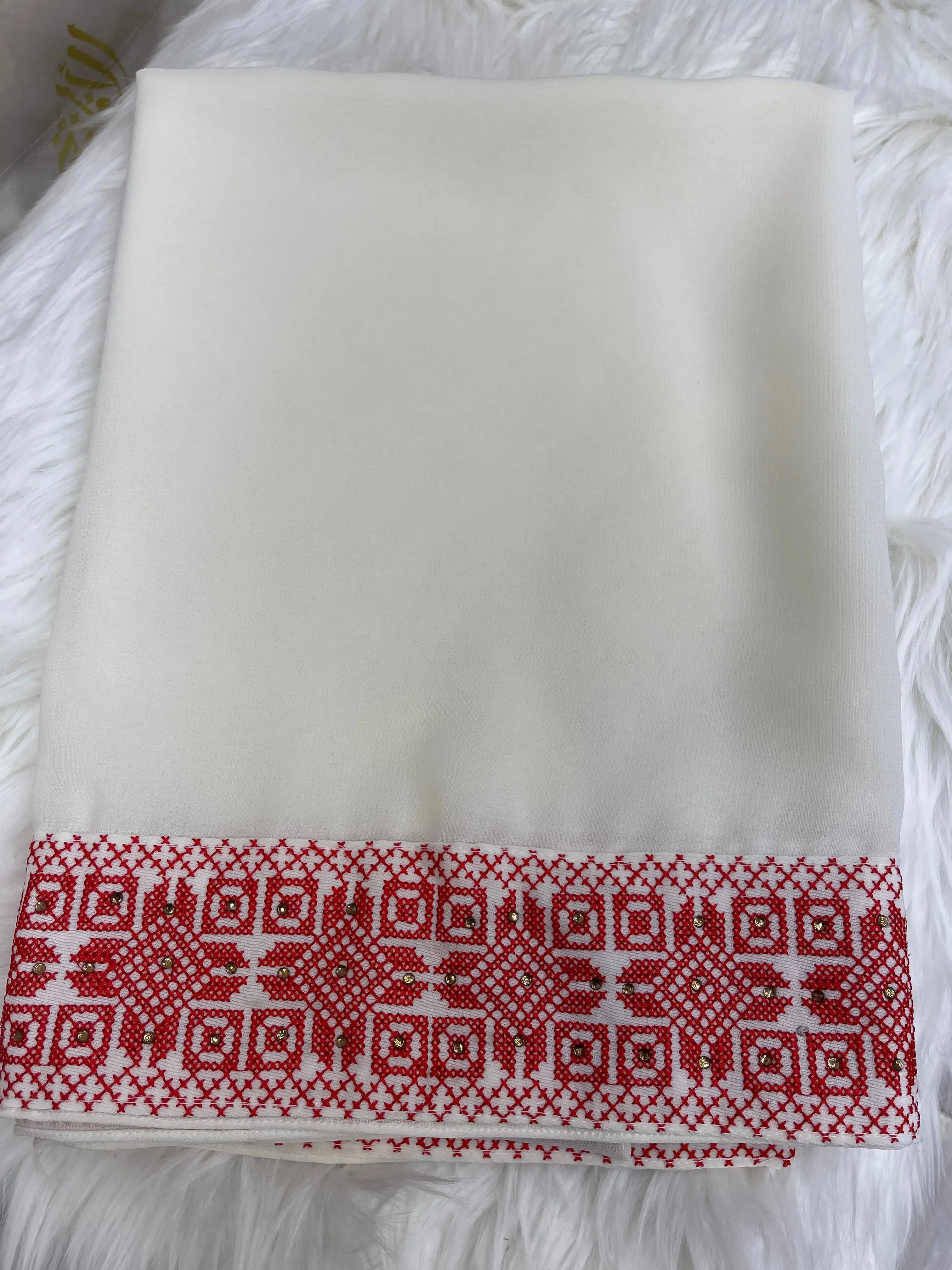 White shawl with red intricate Palestinian embroidery khirka detail on the edge by Palestinian Elegance