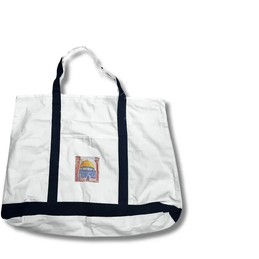 White Palestinian embroidery tote with black handles and decorative embroidery patch