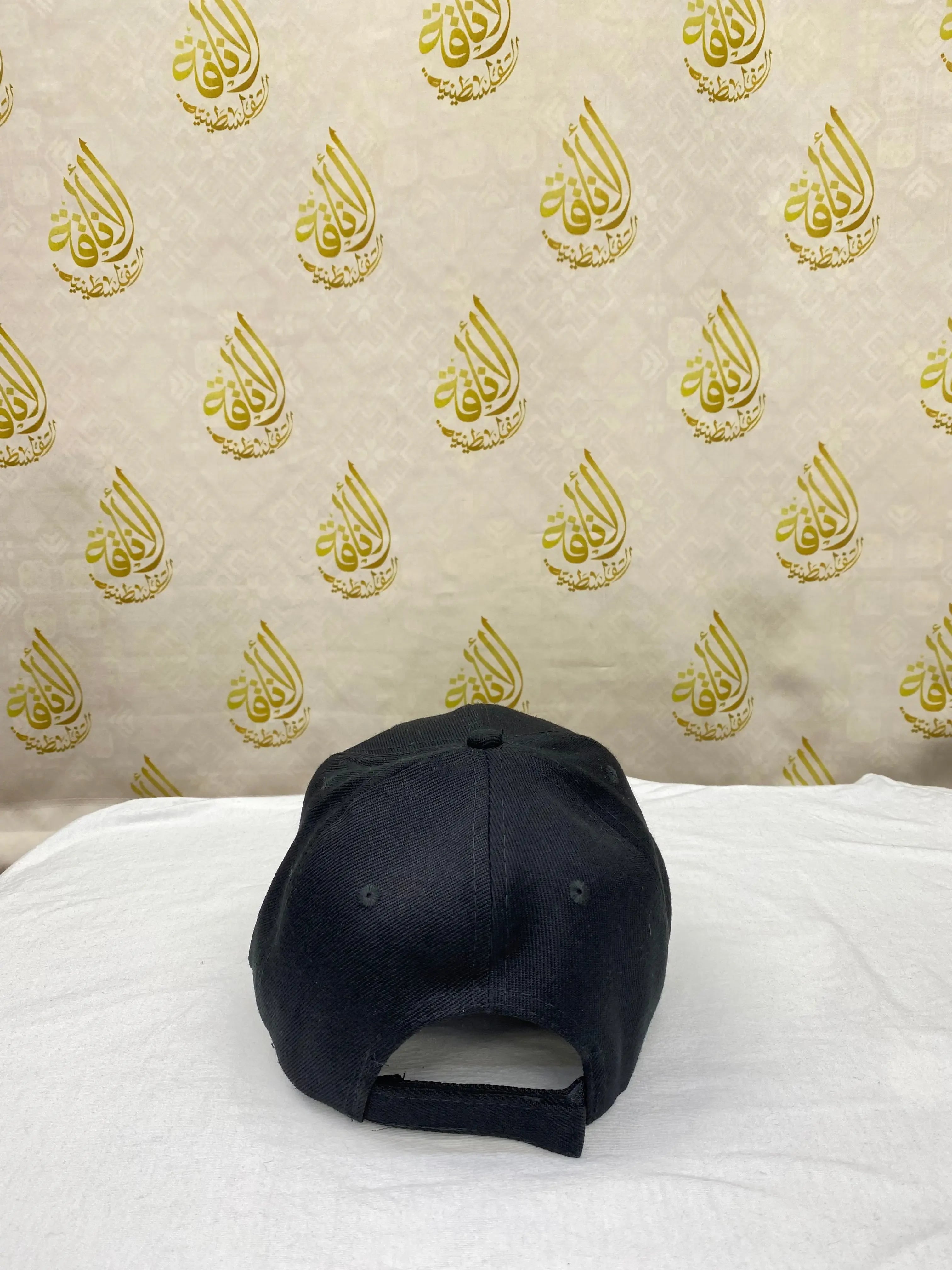 Black Palestinian flag cap displayed from the back with adjustable strap by Palestinian Elegance