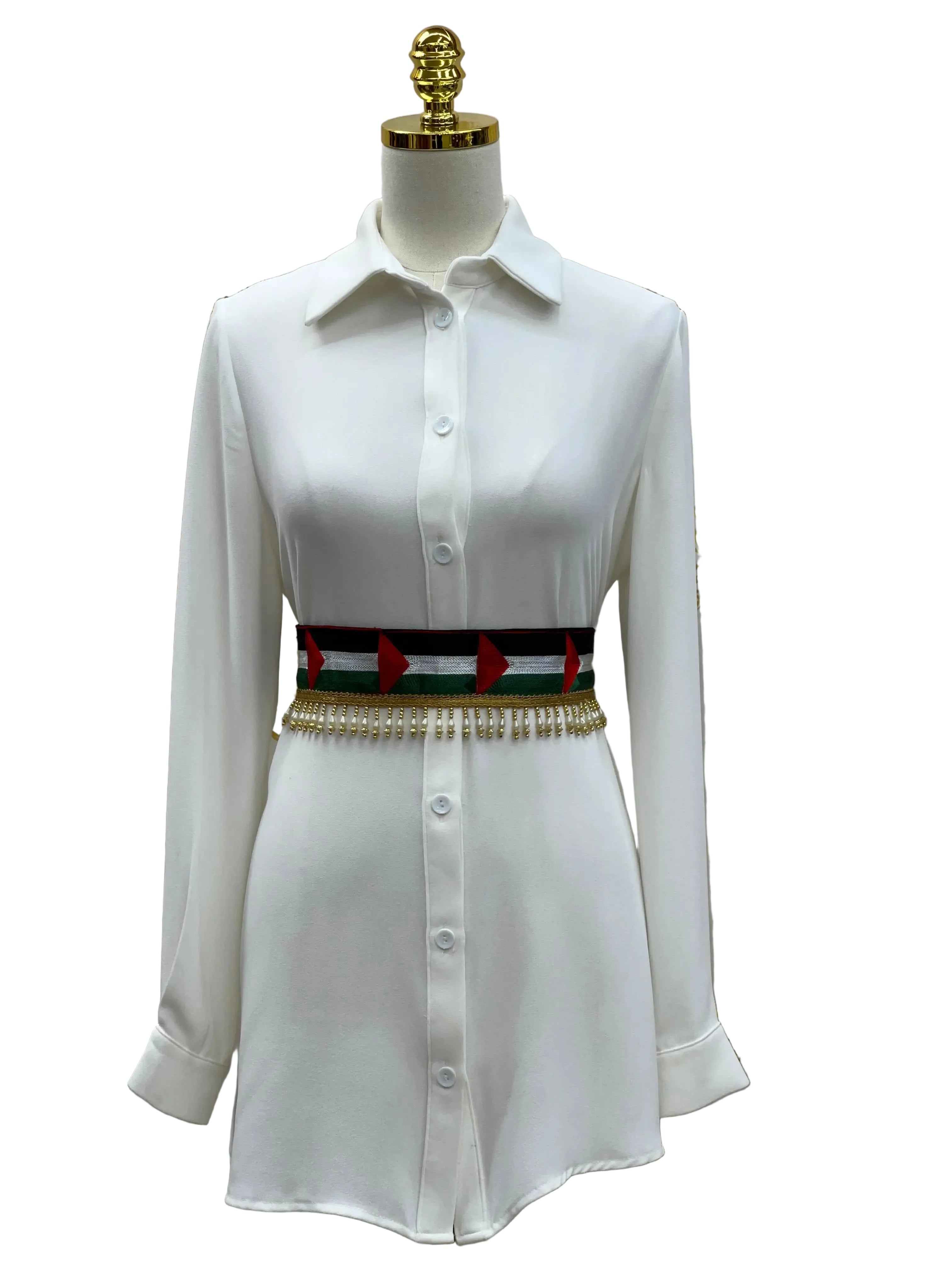 Palestinian flags belt with red, black, white, and green design worn over white button-down dress