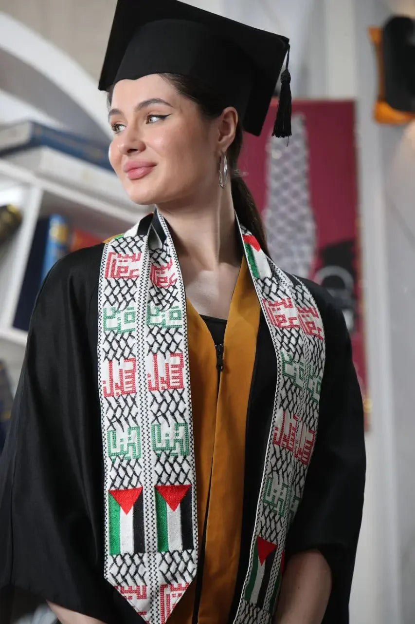 Palestinian graduation stole by Palestinian Elegance worn by graduate in cap and gown indoors