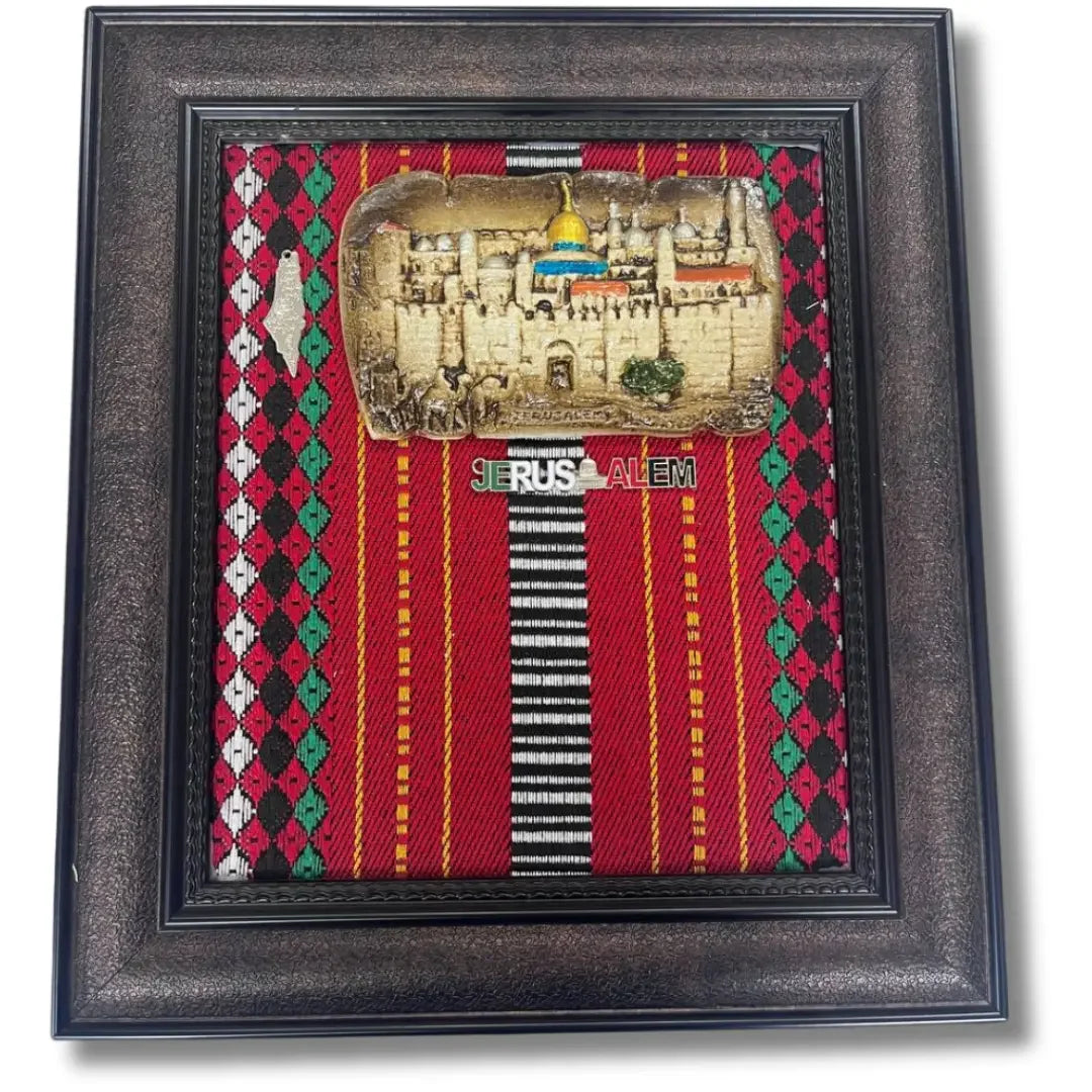 Palestinian handmade picture frame with Jerusalem cityscape on traditional red patterned fabric