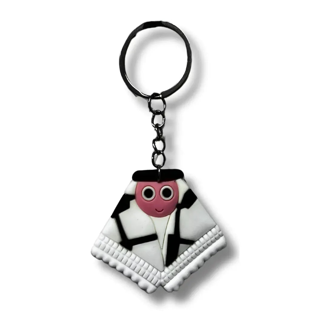 Palestinian keychain accessory featuring a cute character wrapped in a traditional black and white keffiyeh scarf