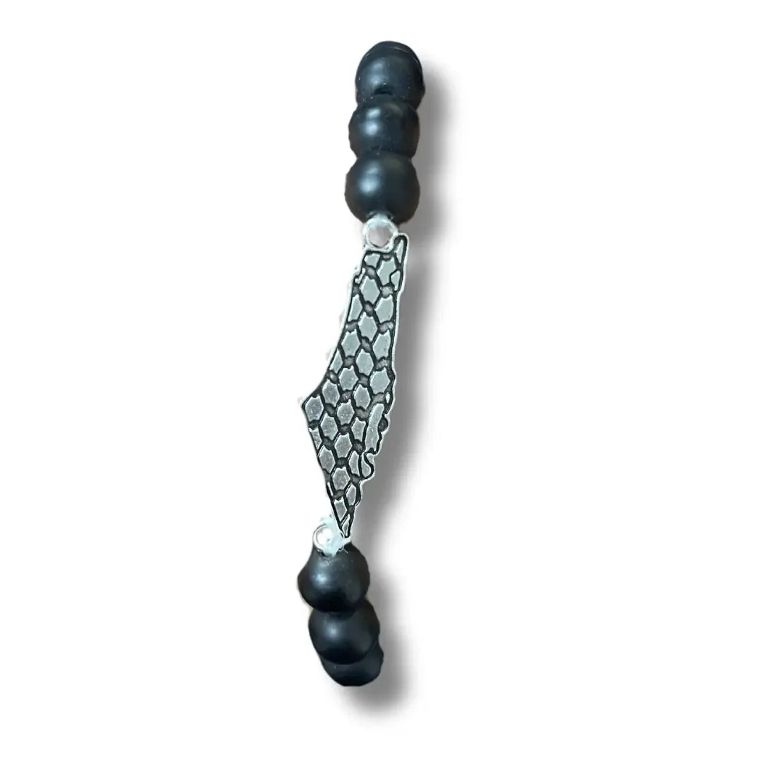 Palestinian kuffiyeh bracelet with black beads and silver-colored map pendant by Palestinian Elegance