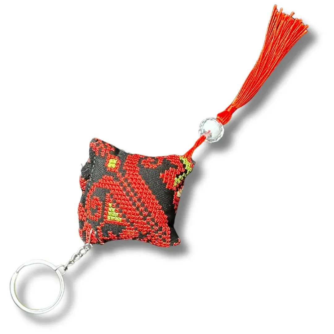 Palestinian tatreez keychains with traditional red and black embroidered design and tassel