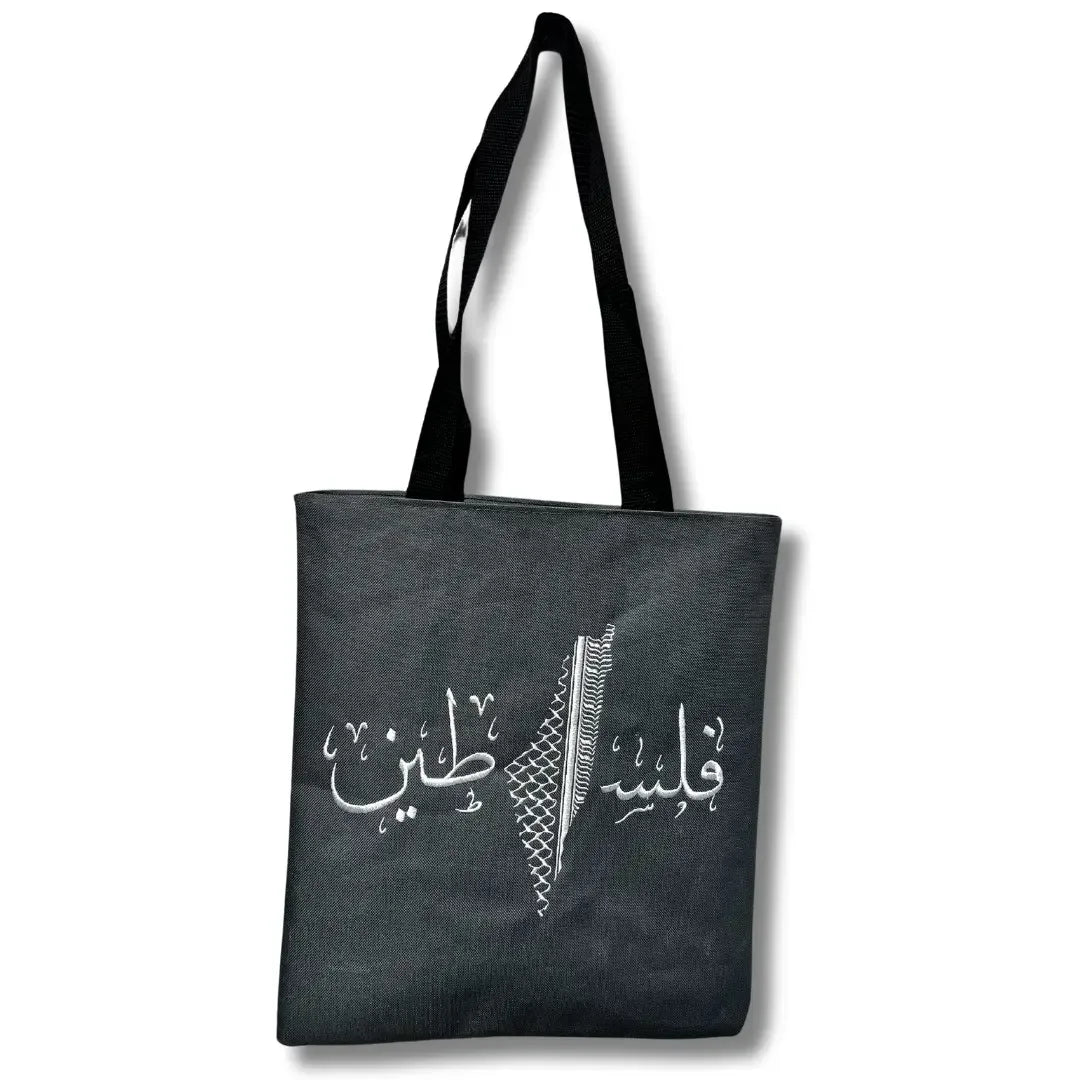 Black Palestinian tote bag with Arabic calligraphy and traditional patterns by Palestinian Elegance