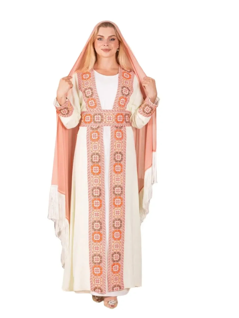 Woman wearing a traditional Palestinian khirka shawl with intricate embroidery by Palestinian Elegance