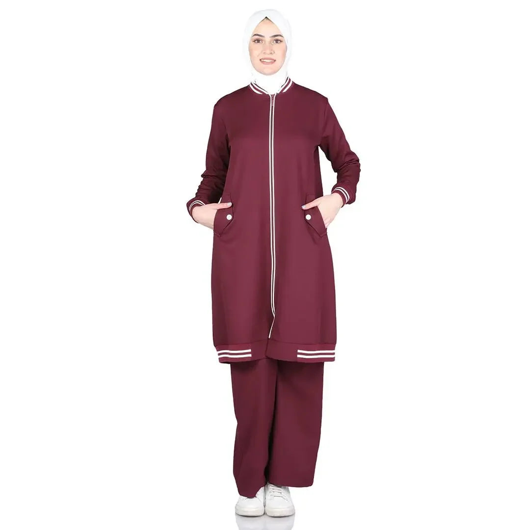 Palestinian Elegance modest light tracking suit in maroon with zip front and pockets, worn with white hijab and sneakers