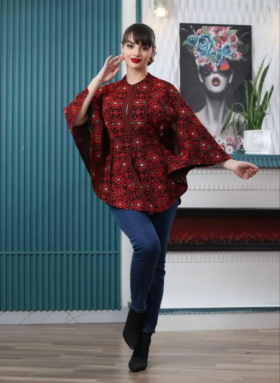 Palestinian embroidered cape red and black casual top with traditional embroidery worn with jeans