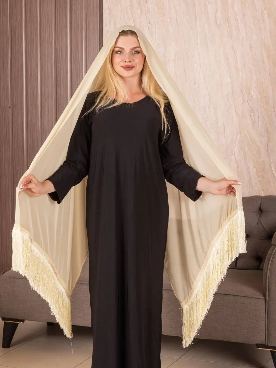 Woman wearing traditional Palestinian khirka cream shawl with fringes from Palestinian Elegance