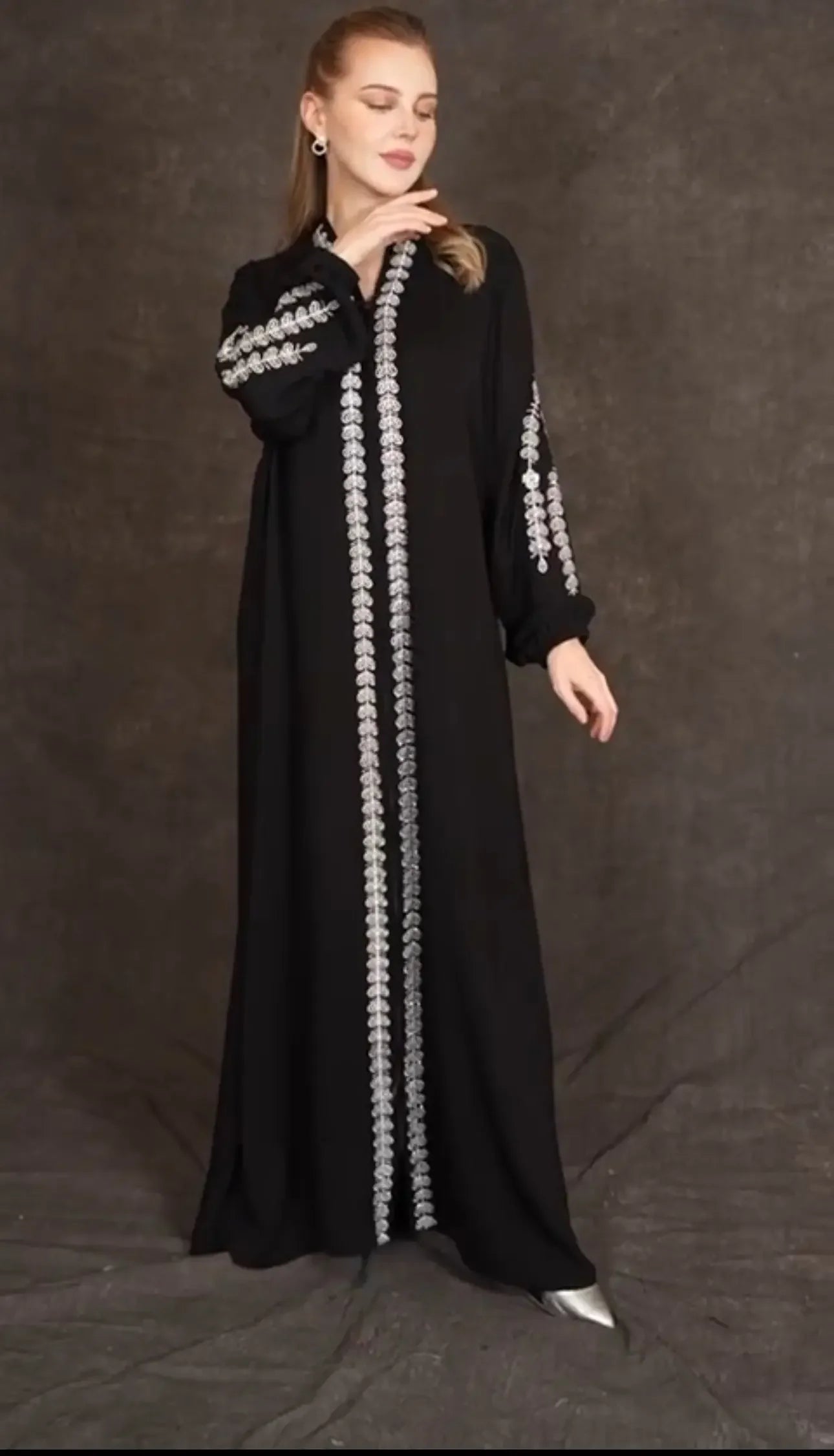 Plus size embroidered abaya in black with silver detailing on sleeves and front by Palestinian Elegance
