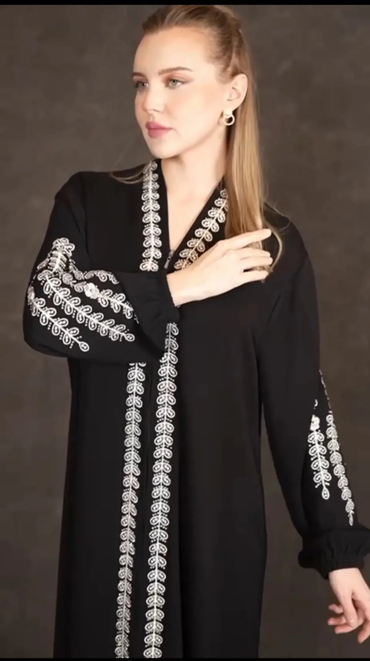 Palestinian Elegance plus size embroidered abaya in black with white detailed embroidery on sleeves and front