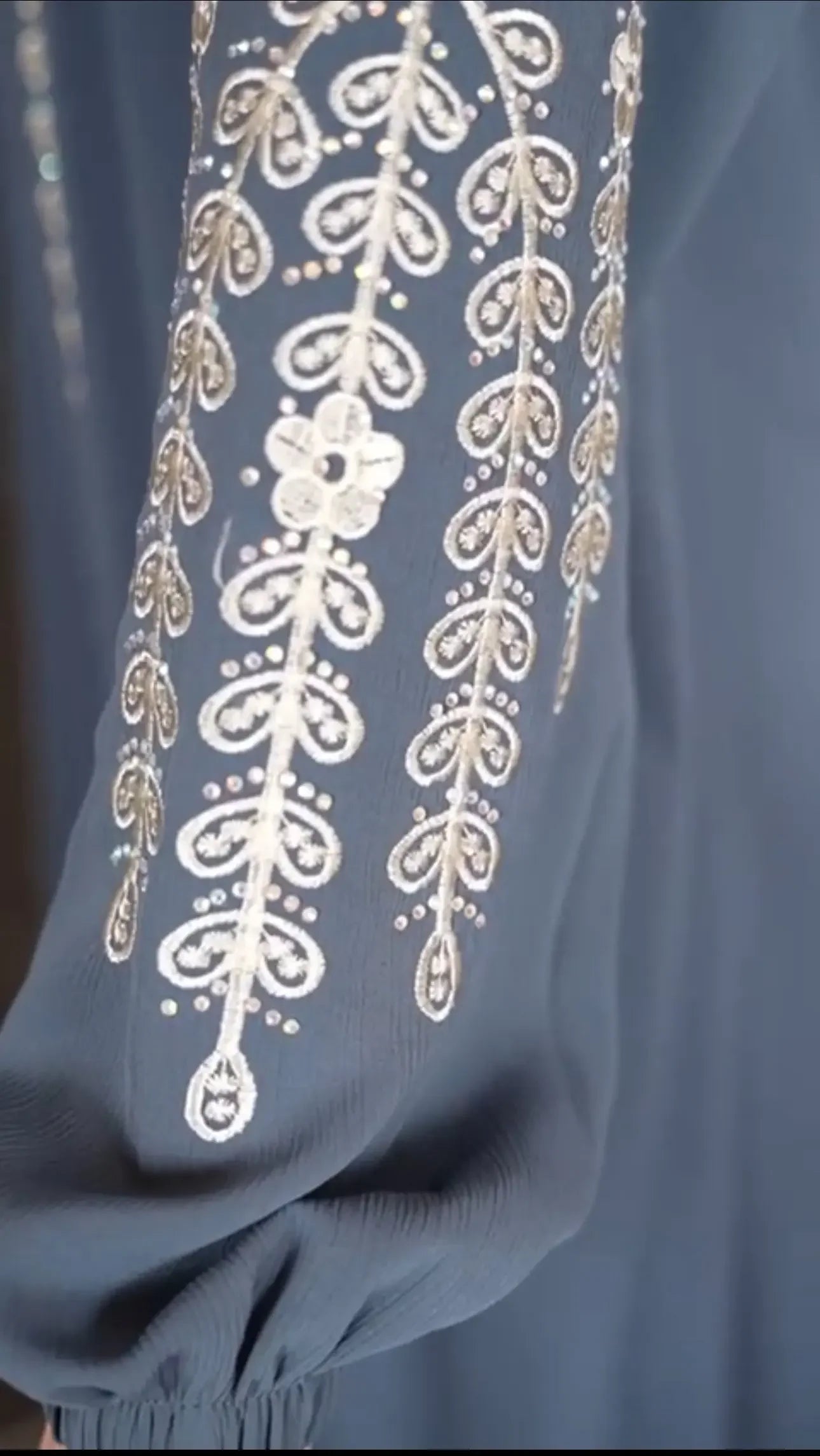 Plus size embroidered abaya sleeve with intricate white floral and leaf patterns from Palestinian Elegance