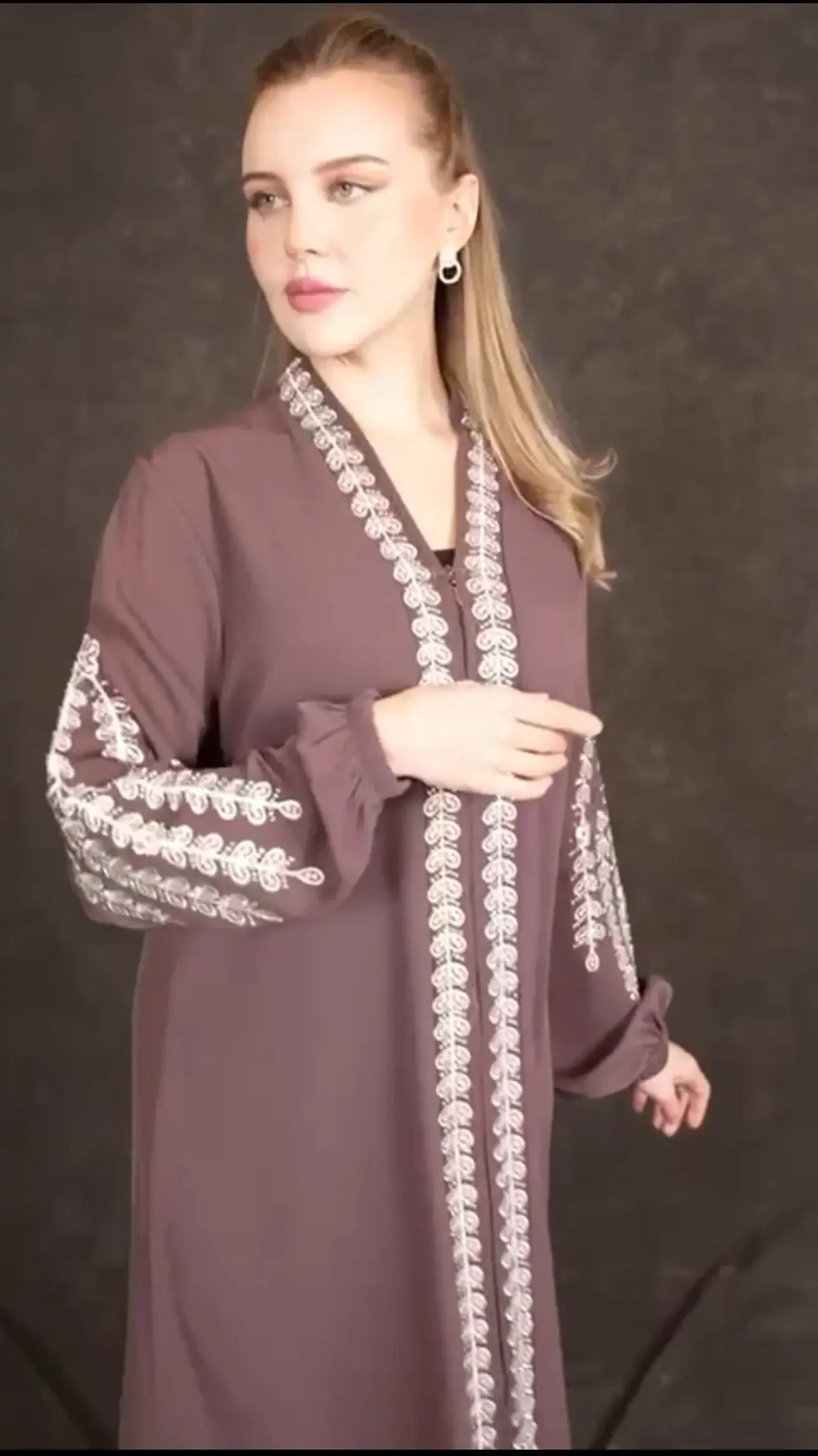 Plus size embroidered abaya by Palestinian Elegance in mauve with intricate white embroidery on sleeves and front