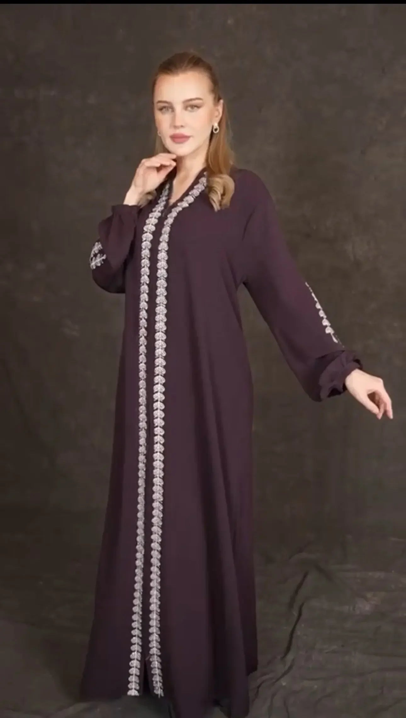 Plus size embroidered abaya in deep purple by Palestinian Elegance with detailed silver embroidery down the front and sleeves