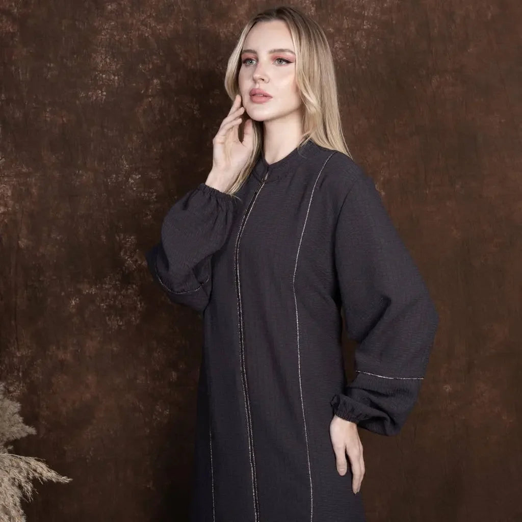 Plus size embroidered abaya by Palestinian Elegance featuring long puff sleeves and front stitching details
