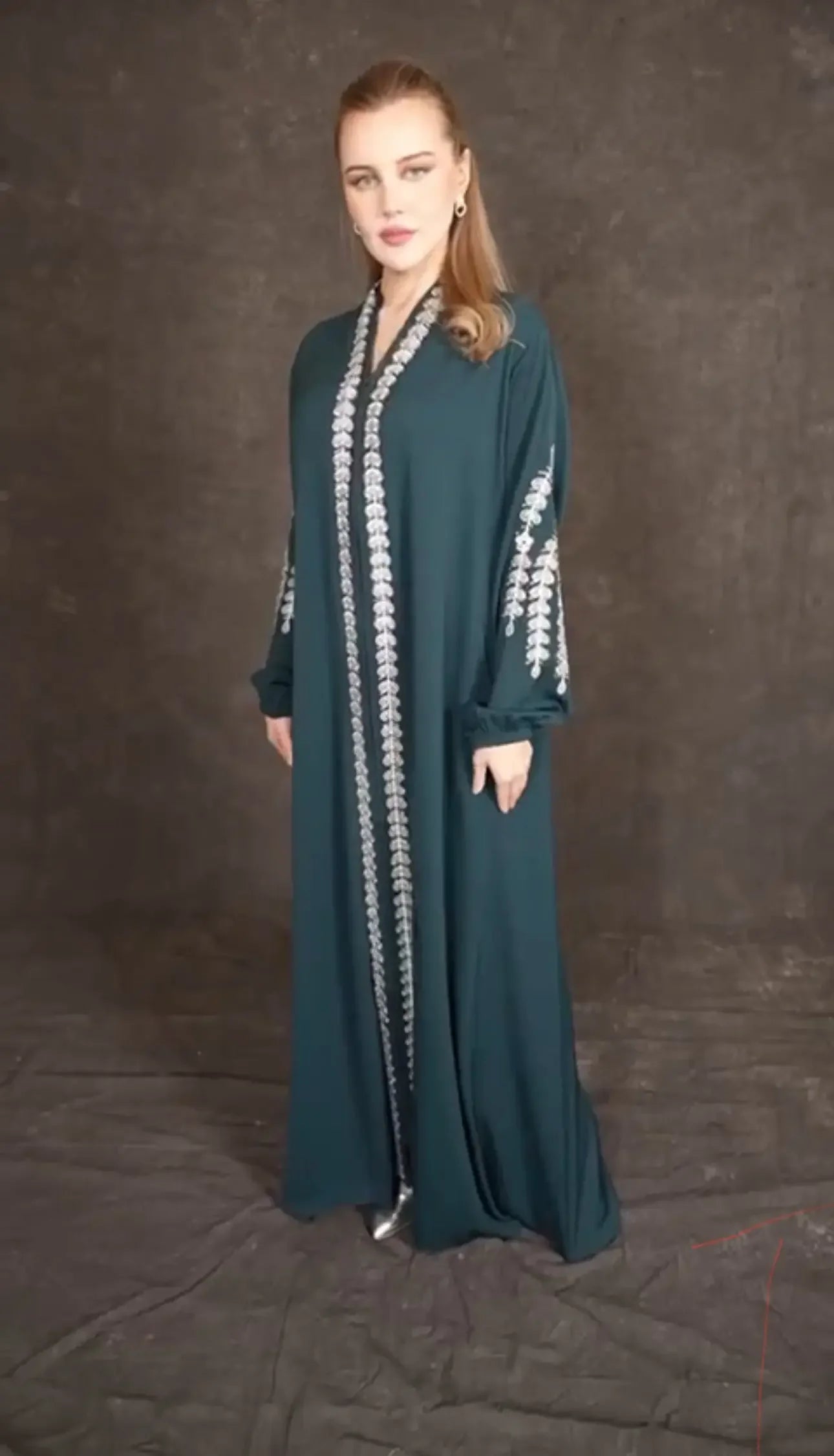 Plus size embroidered abaya in dark green with silver embroidery on sleeves and front by Palestinian Elegance