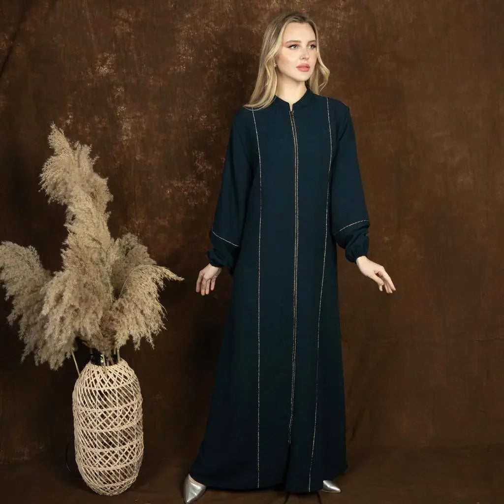 Palestinian Elegance plus size embroidered abaya in black with long sleeves and gold detailing