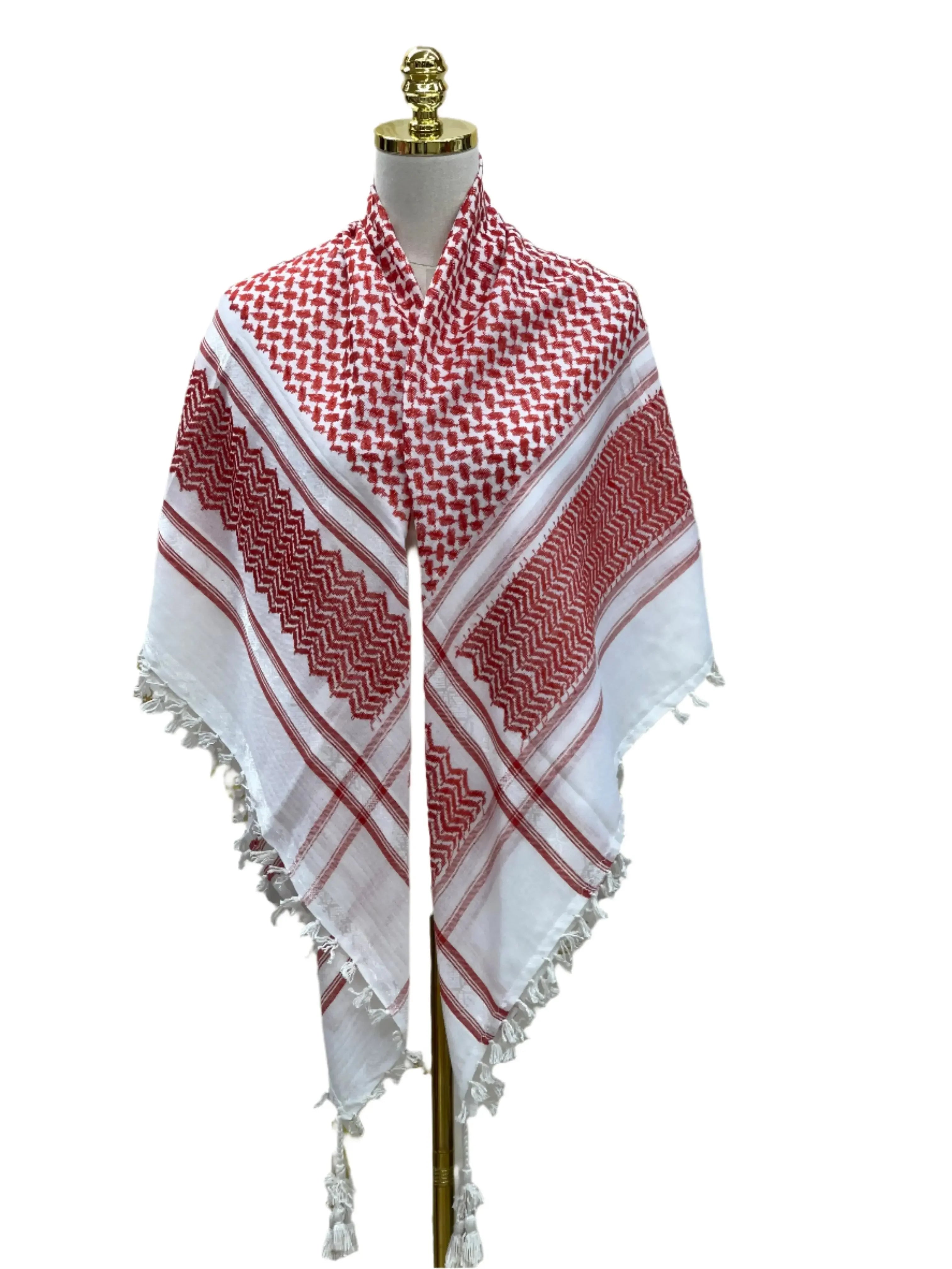 Red and white kuffiyeh scarf draped on a mannequin showcasing traditional Palestinian elegance and design