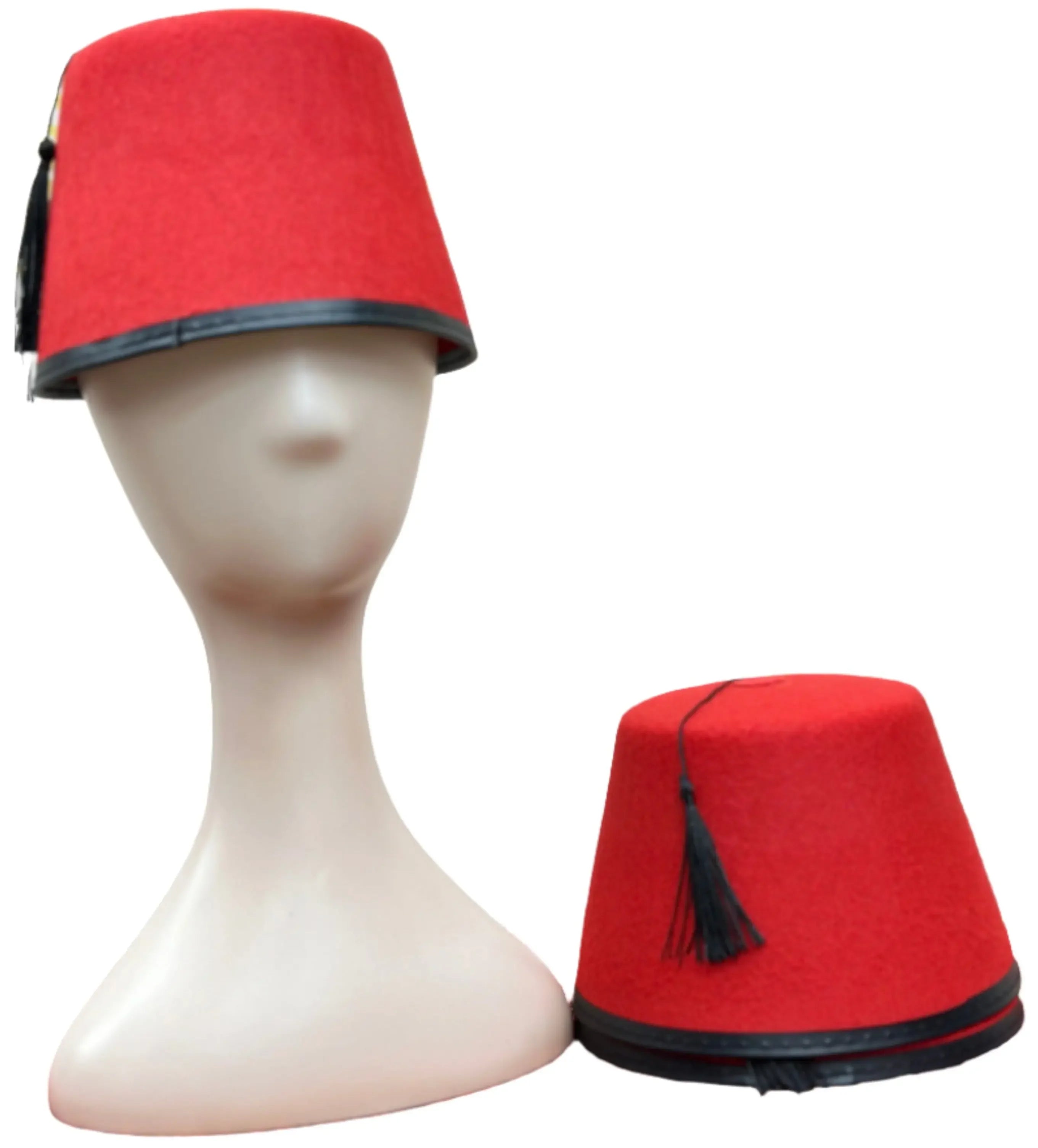 Red traditional tarboosh hat with black tassel and trim displayed on mannequin and beside it