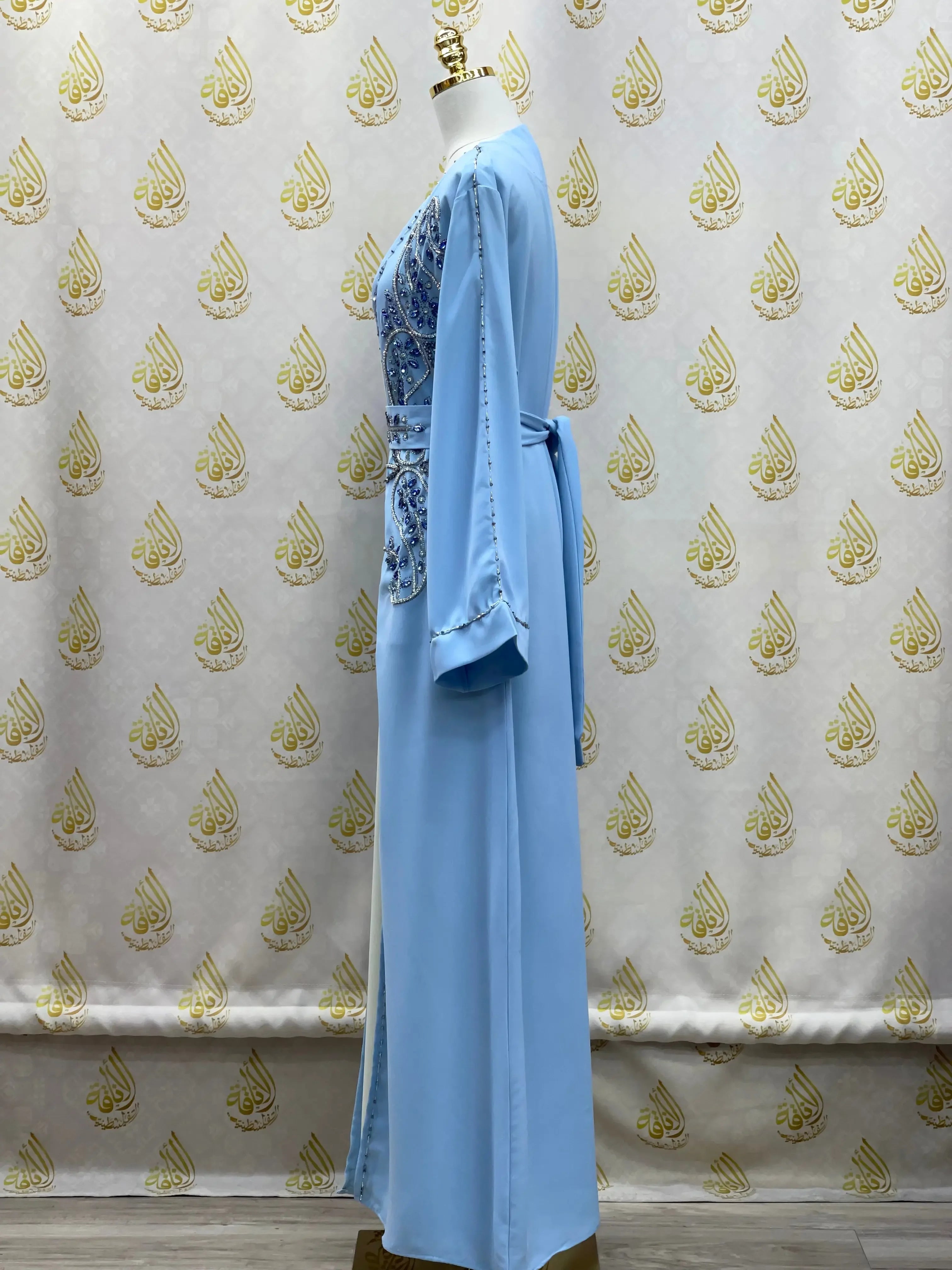 Light blue rhinestone moroccan abaya with intricate front design and long sleeves by Palestinian Elegance