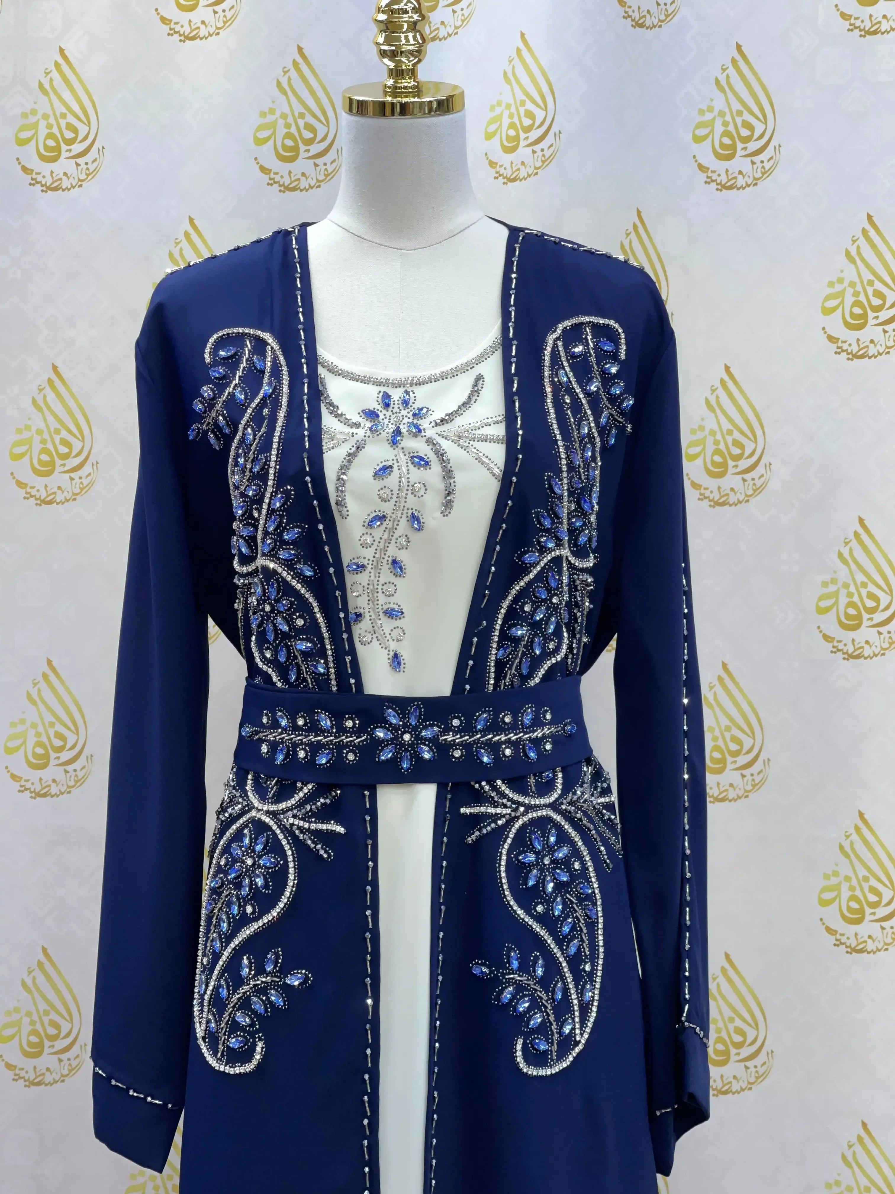 Blue rhinestone moroccan abaya with intricate beadwork and belt from Palestinian Elegance