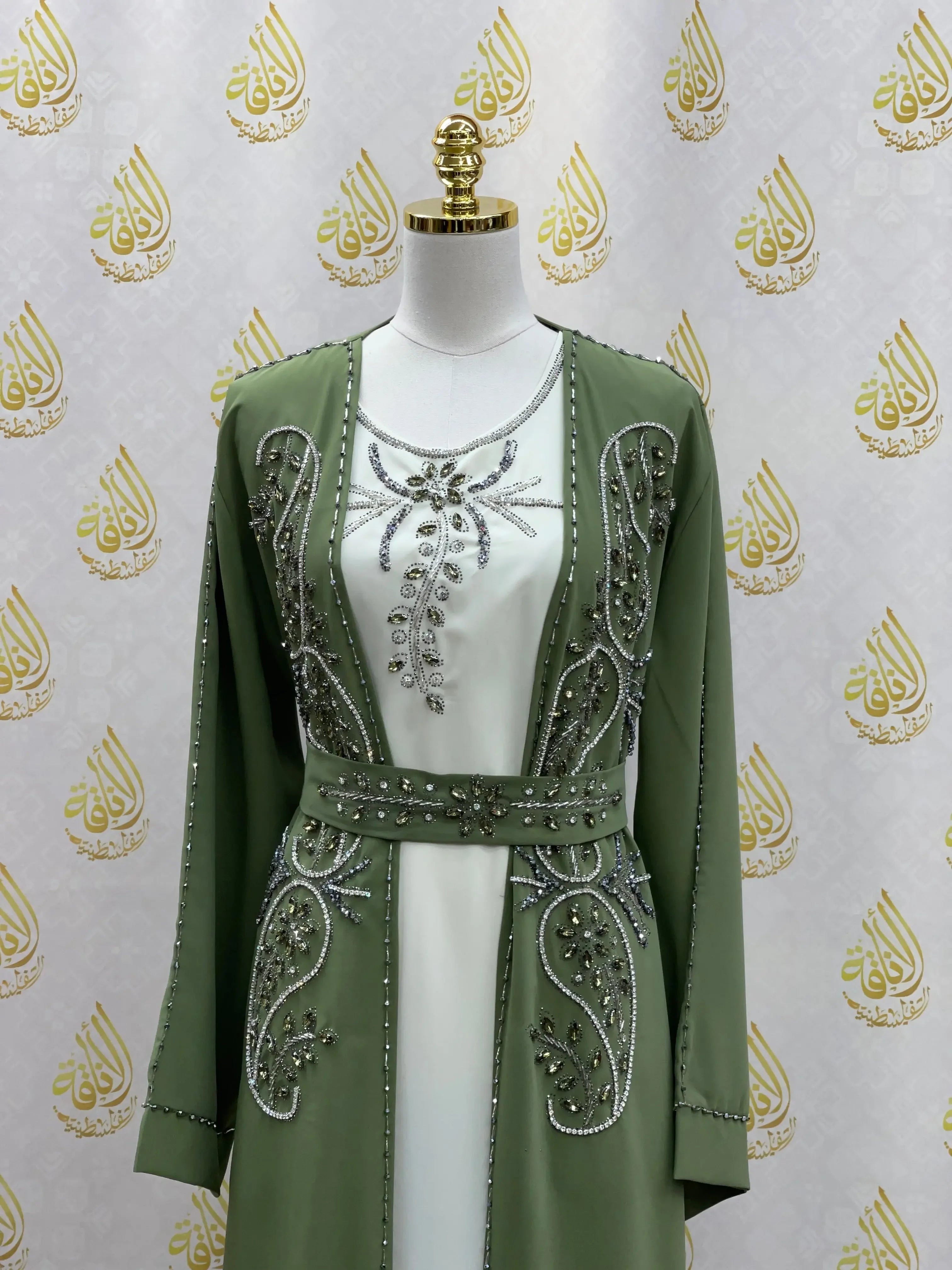 Palestinian Elegance rhinestone moroccan abaya in olive green with intricate silver embellishments and belt