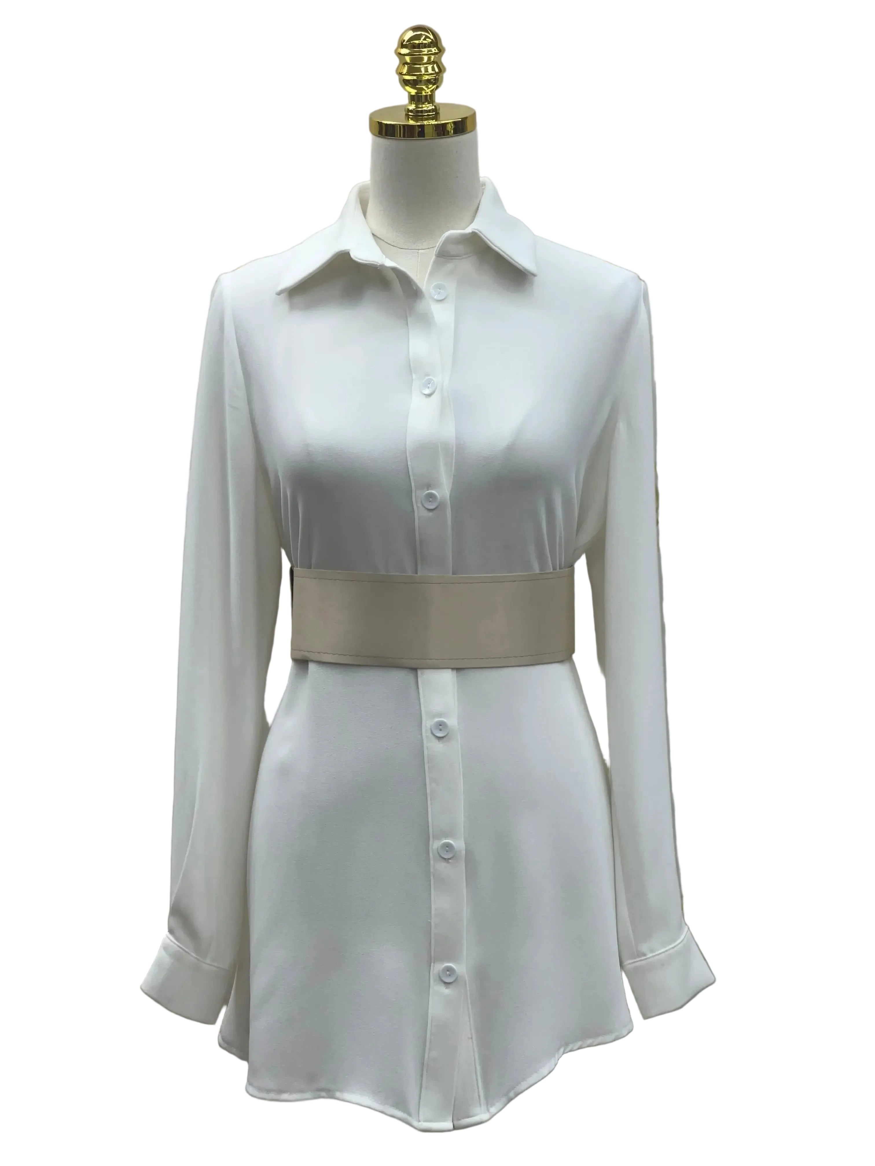 Satin waist belt in beige styled over a white button-down dress on a mannequin