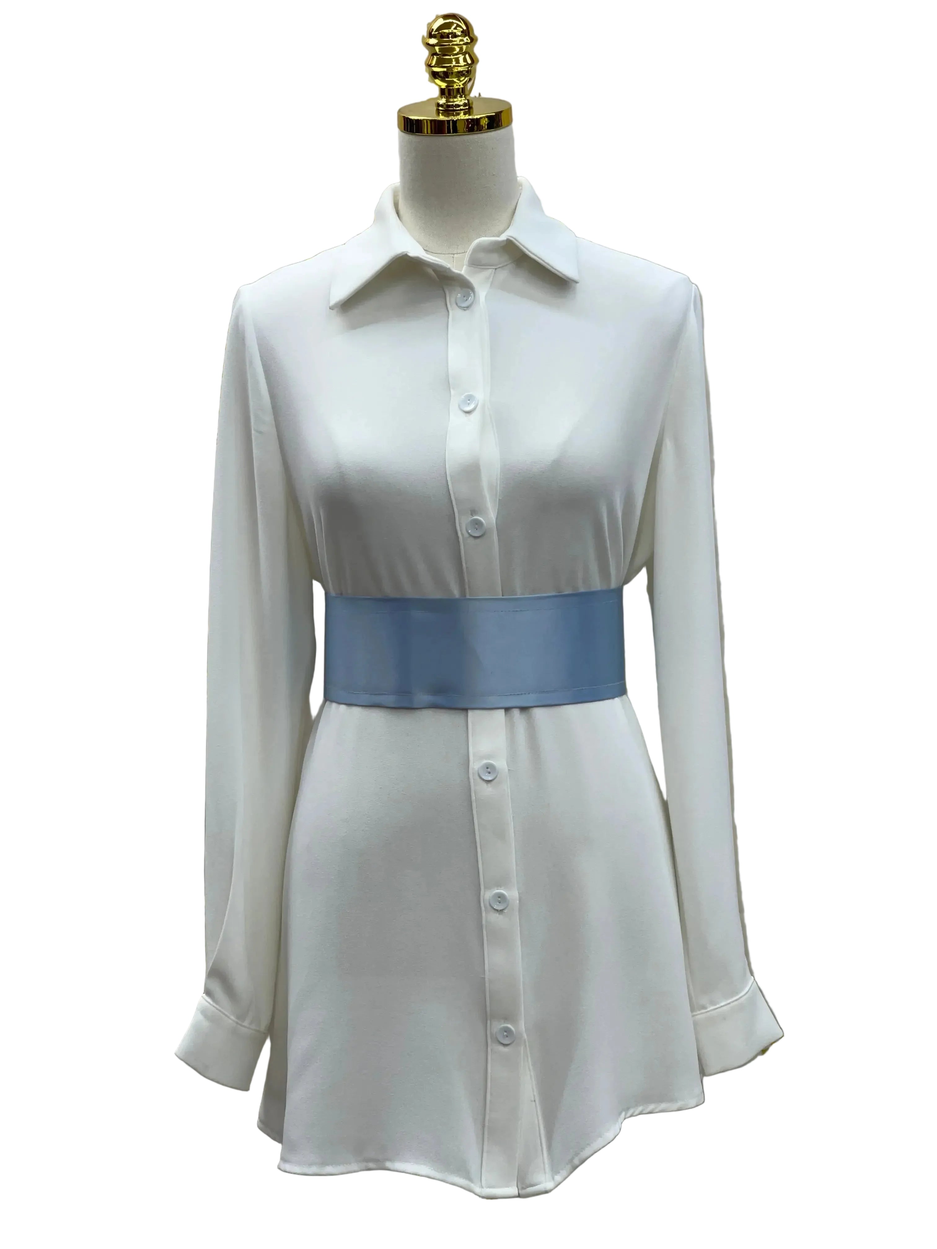 Palestinian Elegance satin waist belt in light blue worn over white button-down dress