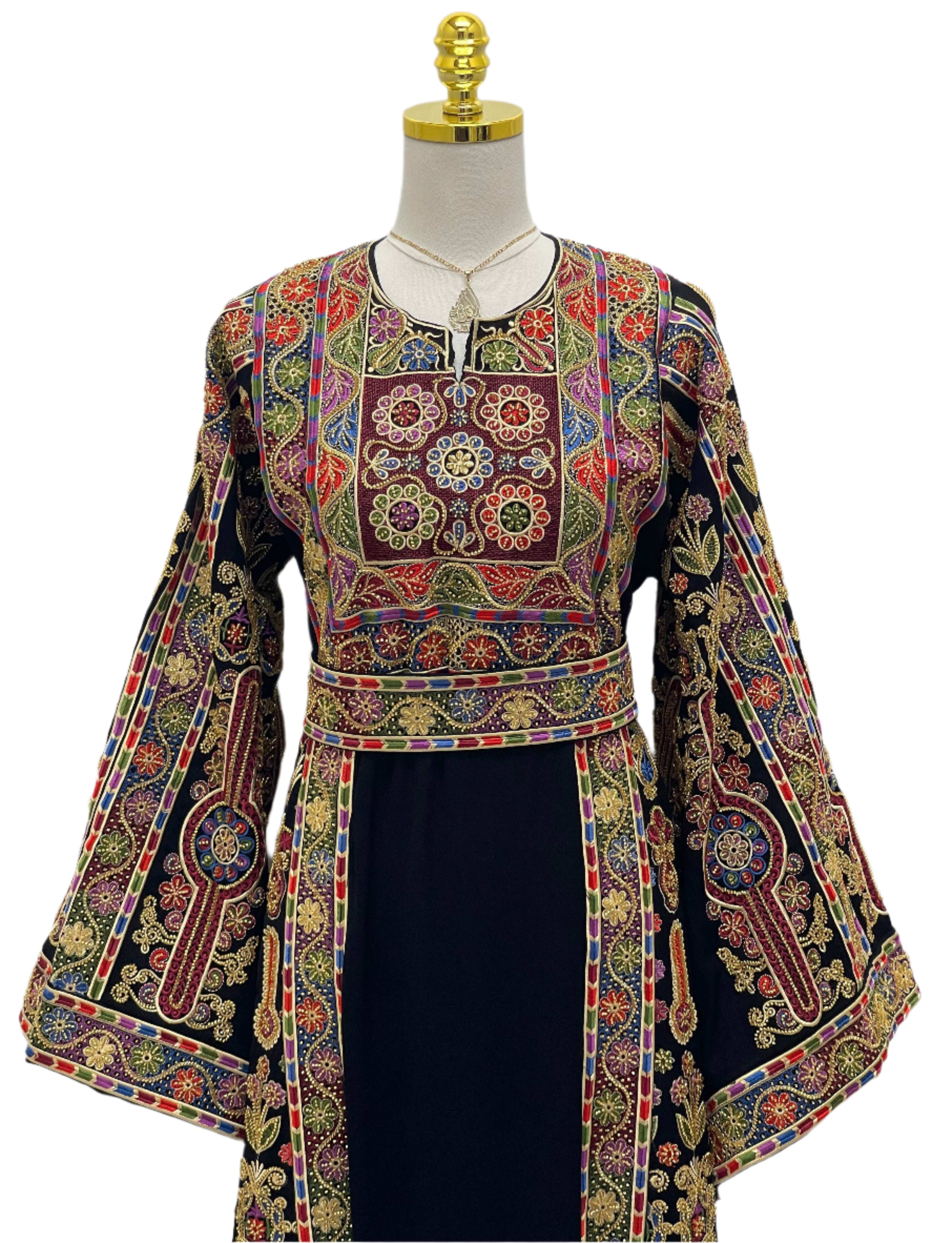 Sofie Heavily Beaded Embroidered Thoub by Palestinian Elegance with intricate colorful floral embroidery on black fabric