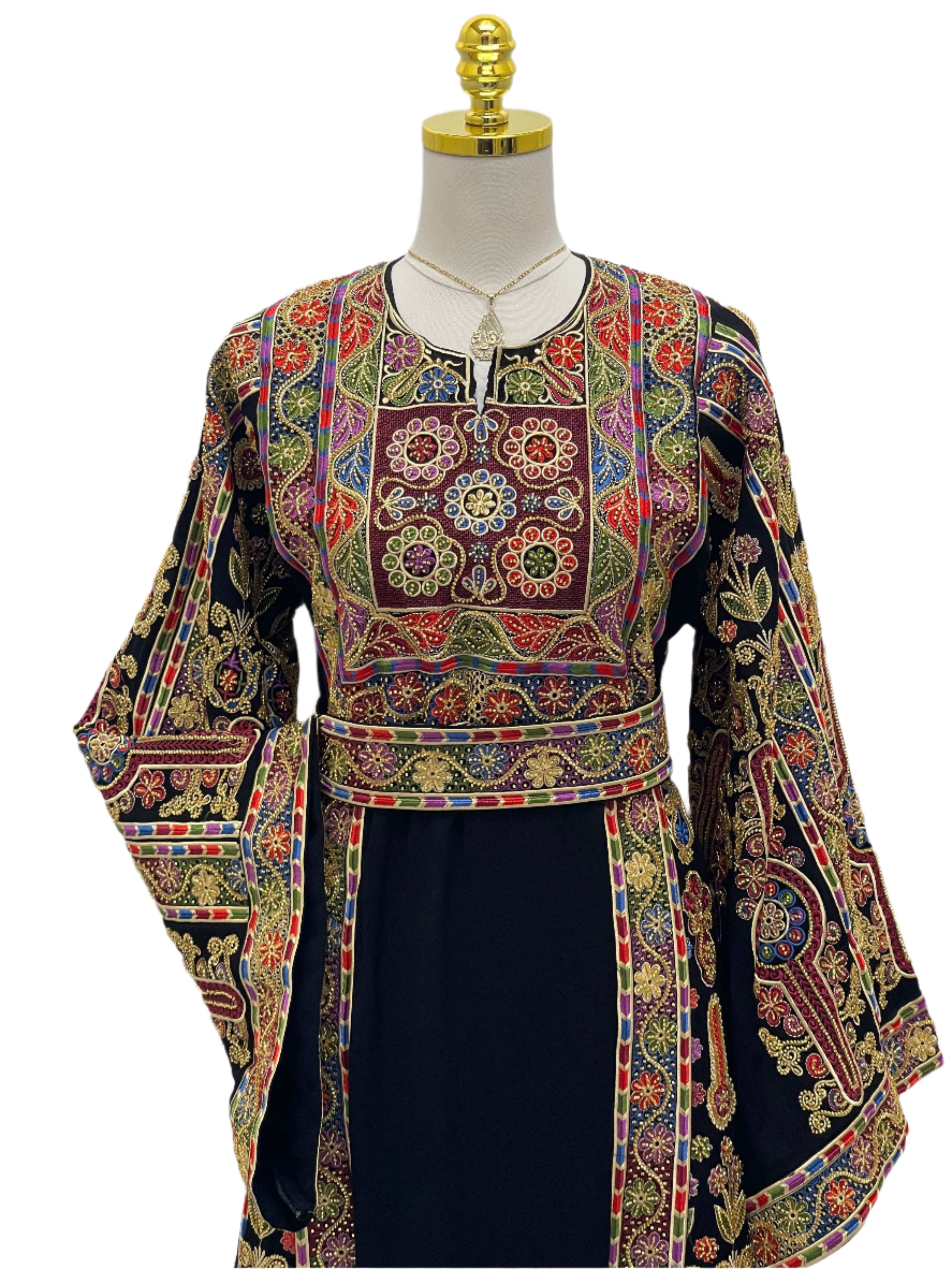 Sofie Heavily Beaded Embroidered Thoub by Palestinian Elegance with vibrant floral embroidery on black fabric