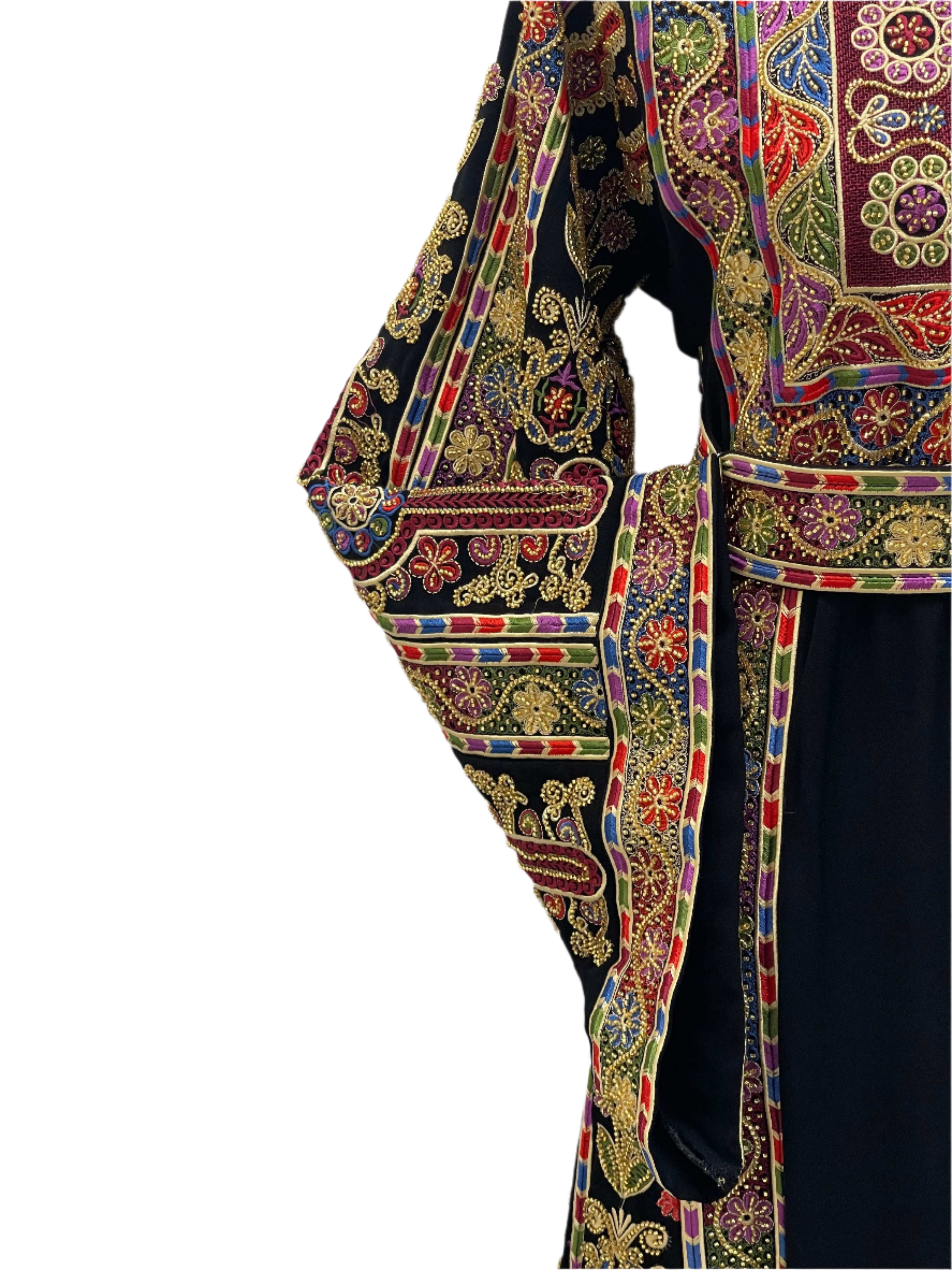 Palestinian Elegance Sofie Heavily Beaded Embroidered Thoub showcasing intricate colorful beadwork on dark fabric