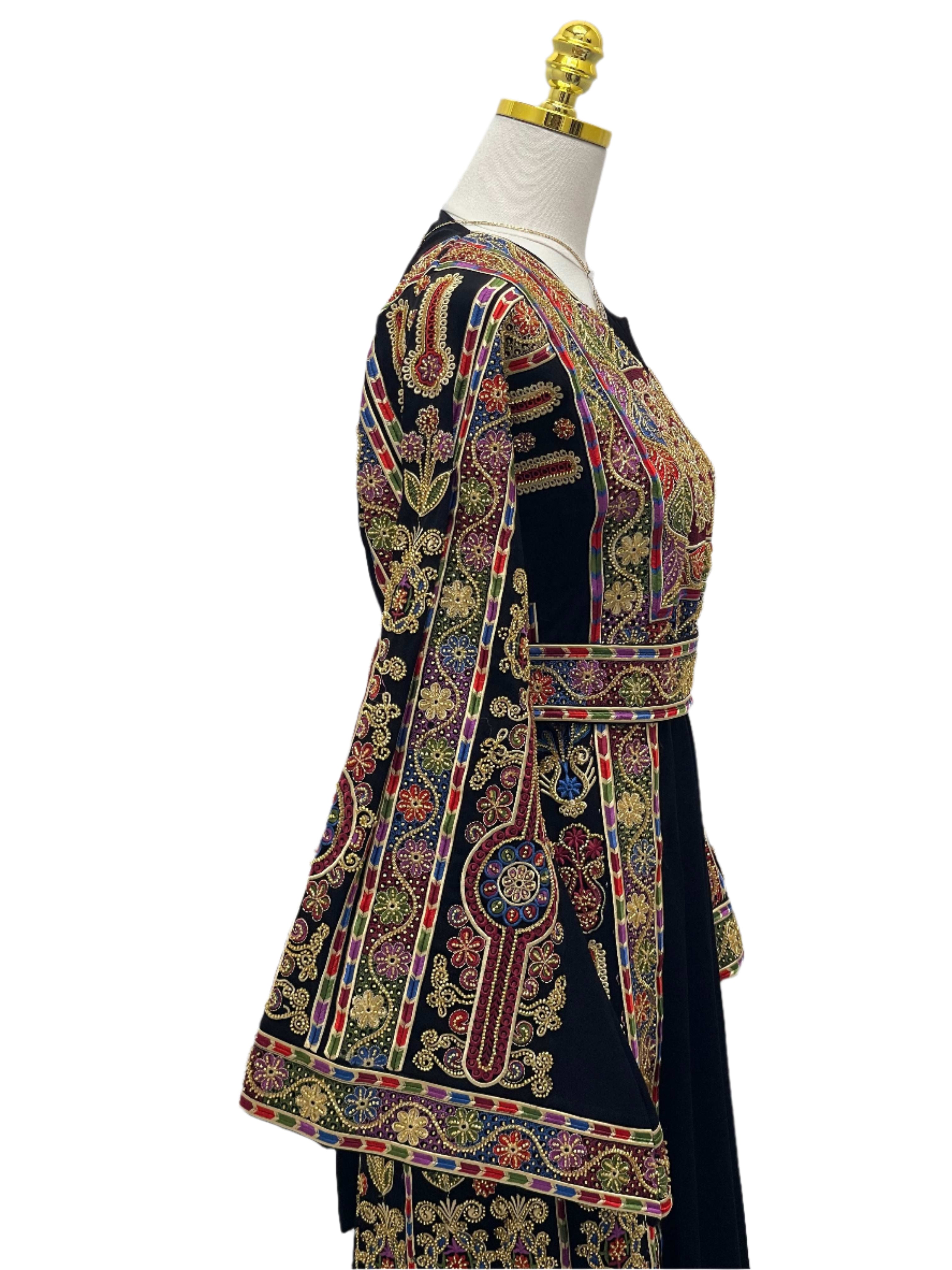 Sofie Heavily Beaded Embroidered Thoub by Palestinian Elegance with intricate gold and colorful embroidery on dark fabric