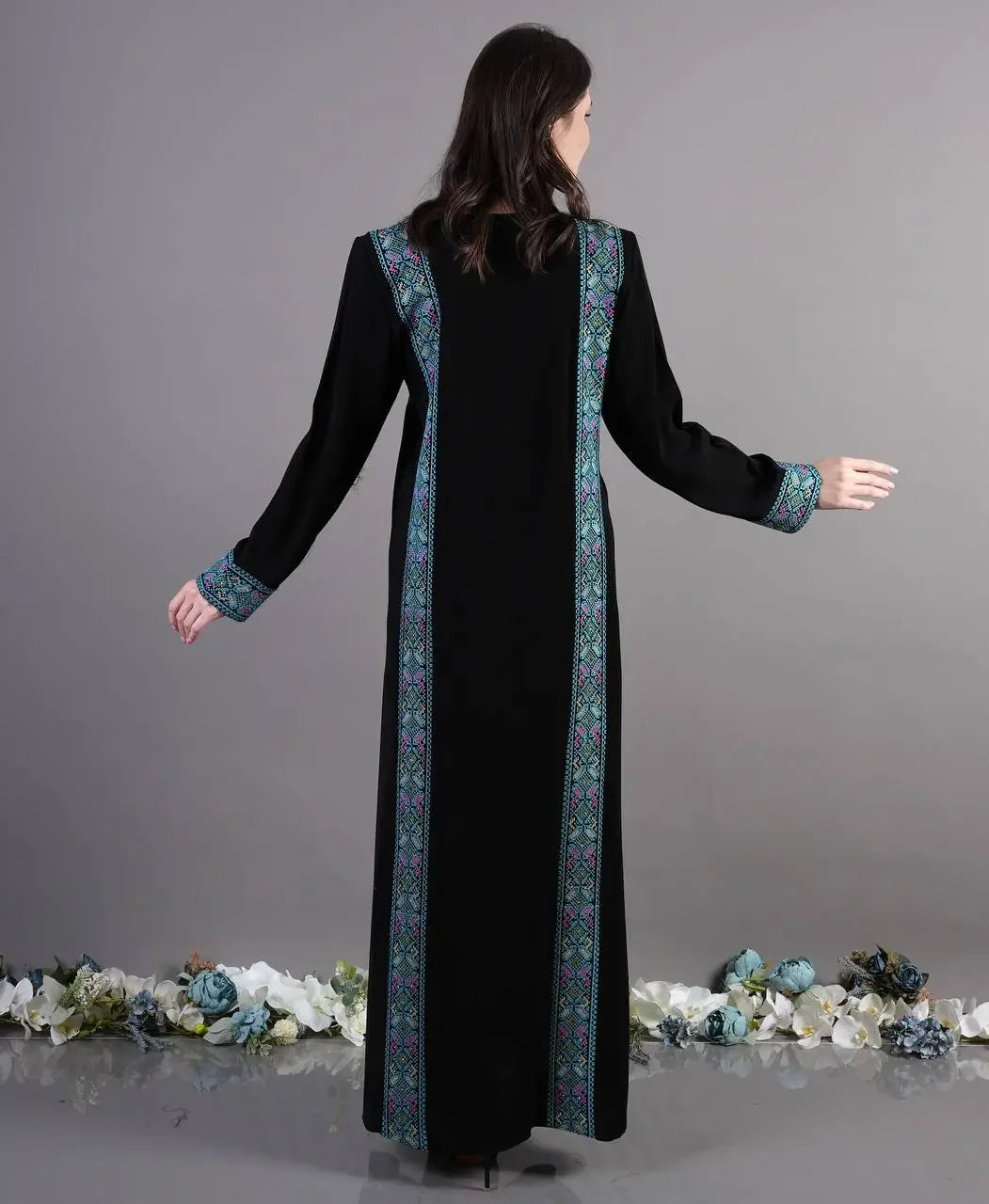 Back view of Palestinian Elegance black Tatreez Abaya Dress with embroidered blue and green traditional patterns