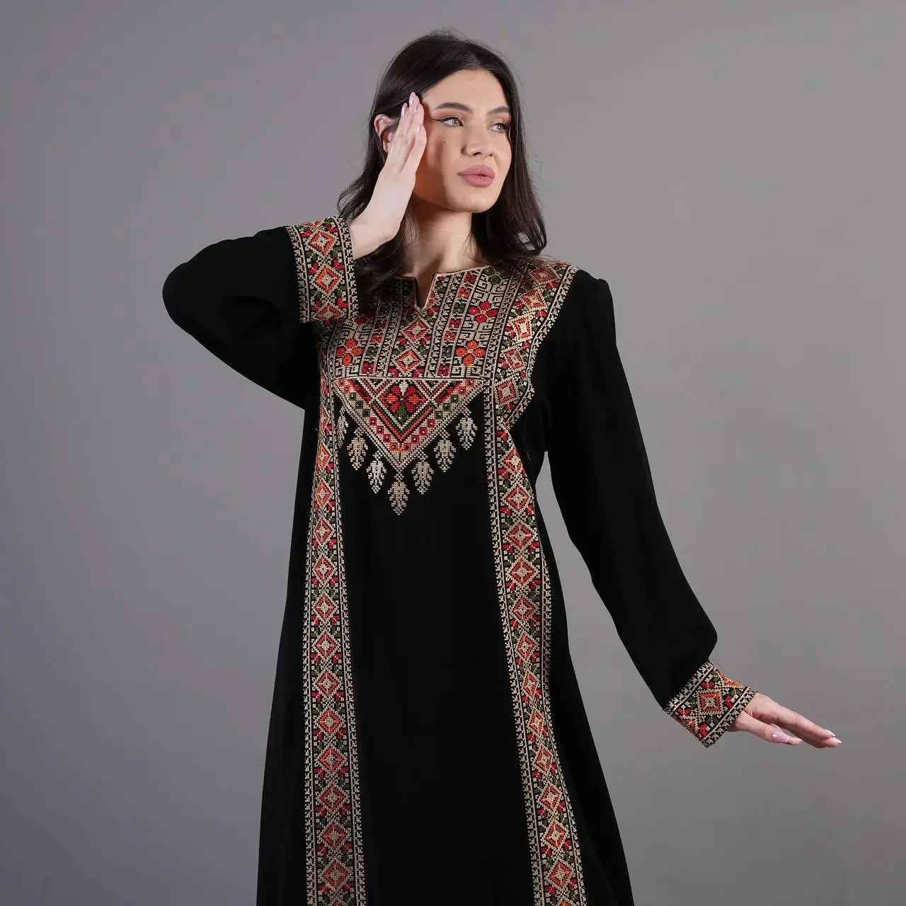 Palestinian Elegance black Tatreez Abaya Dress with traditional embroidery on front and sleeves