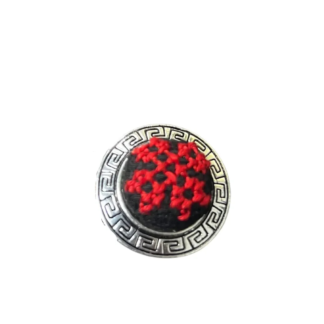Palestinian Elegance tatreez adjustable ring with red embroidered design and silver patterned border
