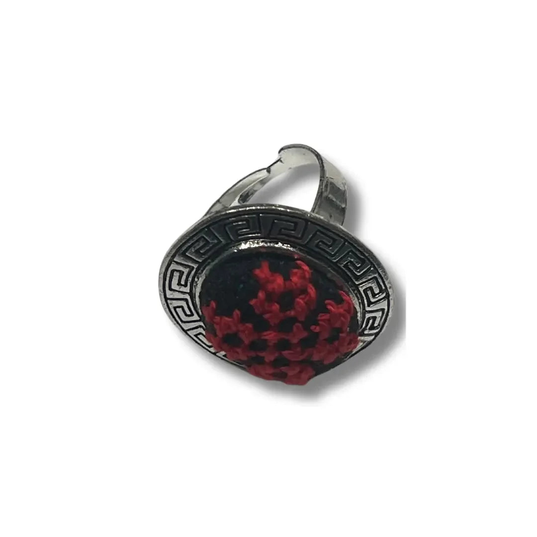 Palestinian Elegance tatreez adjustable ring featuring black and red embroidery with silver-tone metal band