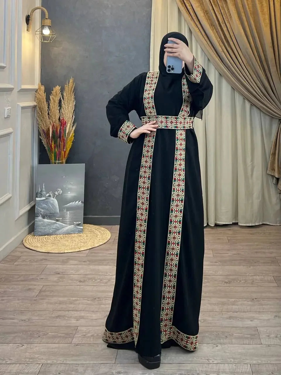 Palestinian Elegance black abaya with red and white tatreez embroidered abaya detailing on sleeves and front