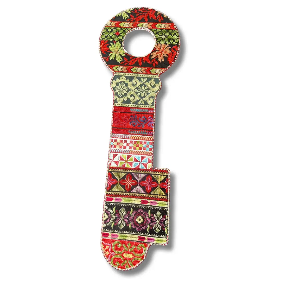 Colorful Palestinian Elegance tatreez key accessory with intricate traditional embroidery patterns