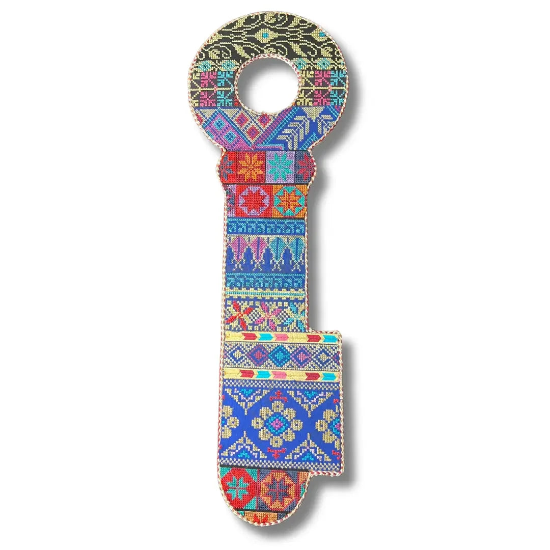 Colorful Palestinian Elegance tatreez key accessory with intricate traditional embroidered patterns