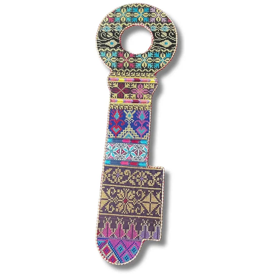 Palestinian Elegance tatreez key accessory featuring colorful traditional embroidery in key shape