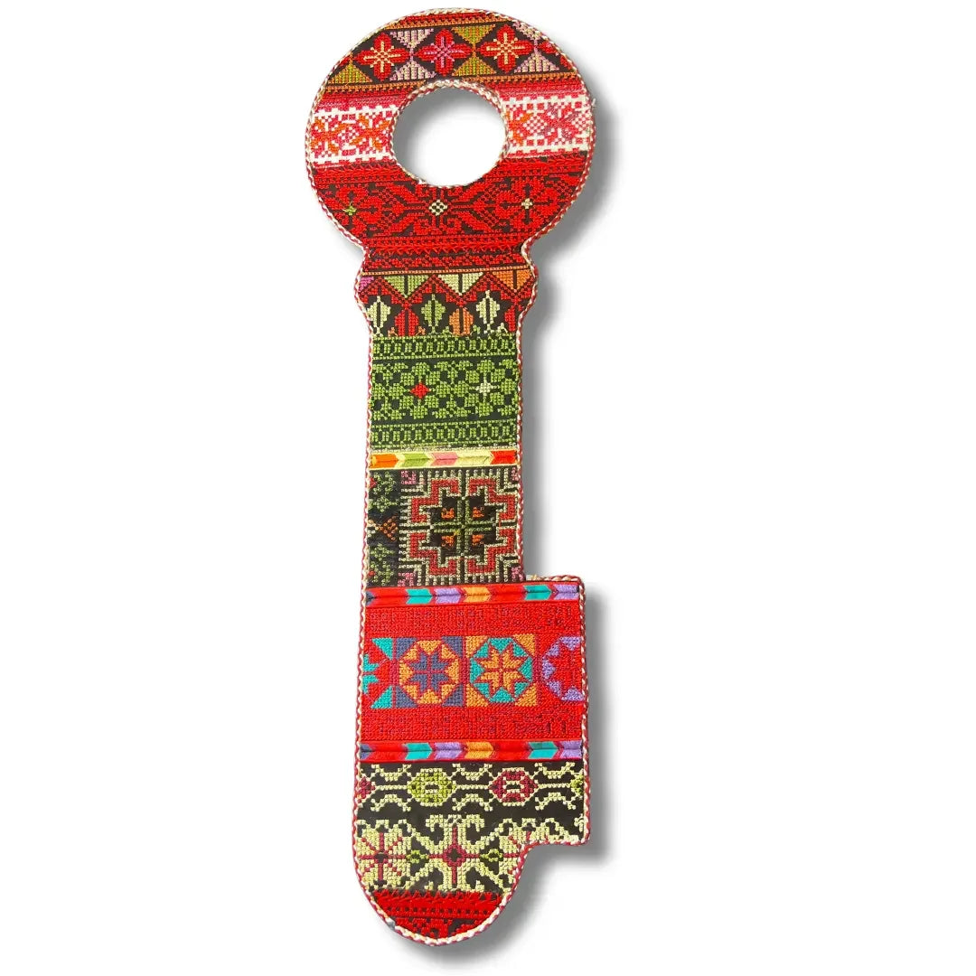 Palestinian Elegance tatreez key accessory featuring traditional colorful embroidery patterns