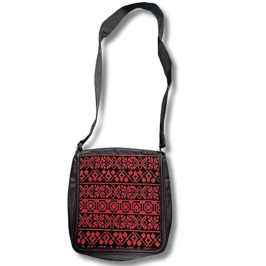 Palestinian Elegance Tatreez shoulder bag with traditional red and black embroidery and adjustable black strap