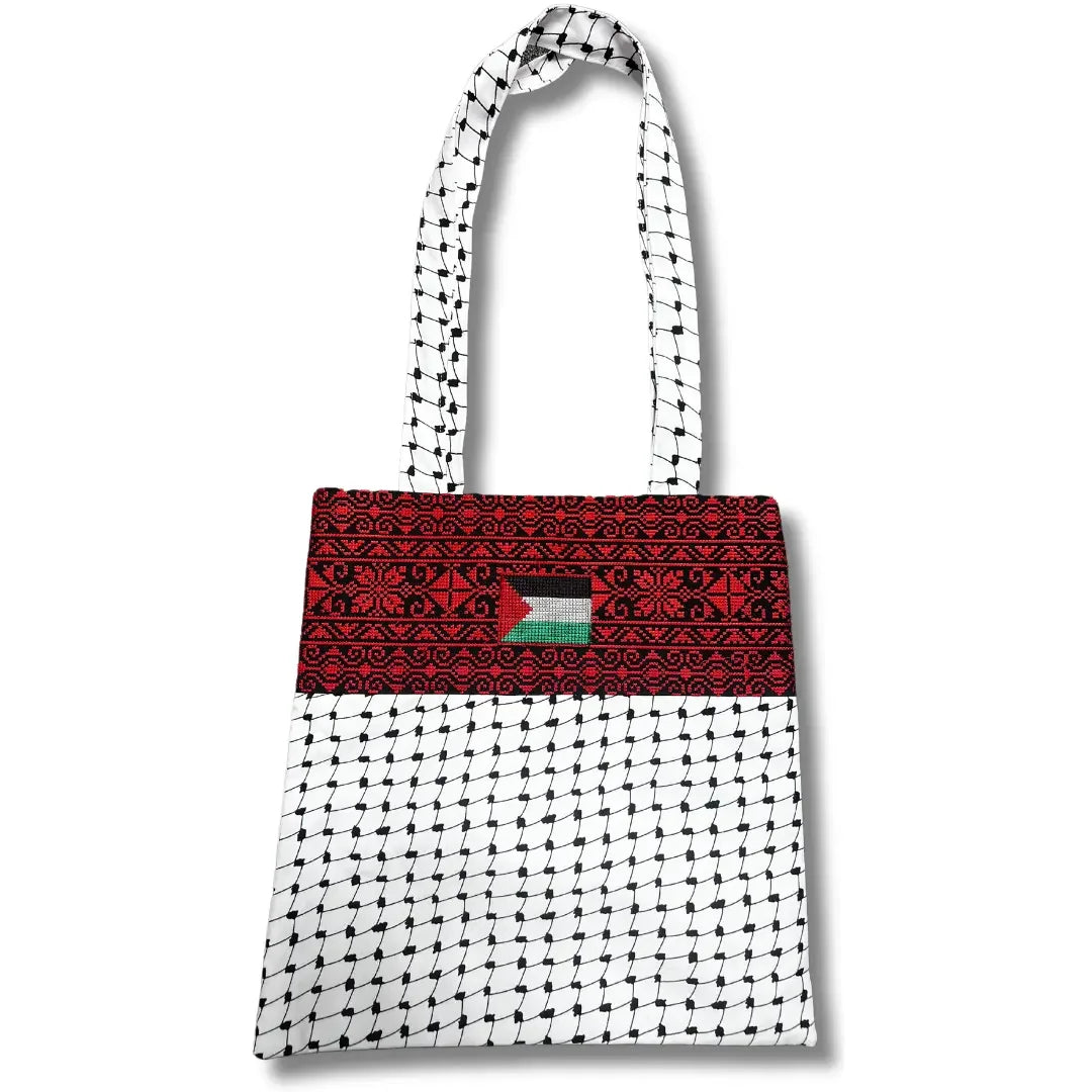 Palestinian Elegance tatreez tote bag with traditional red embroidery and black and white patterned fabric