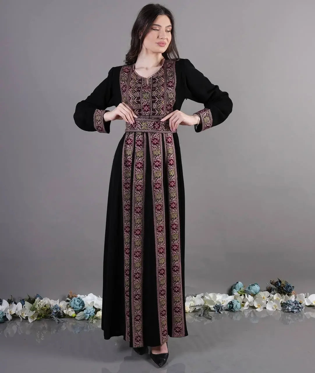 Palestinian Elegance Traditional Embroidered Abaya in black with intricate pink and gold embroidery on front and sleeves