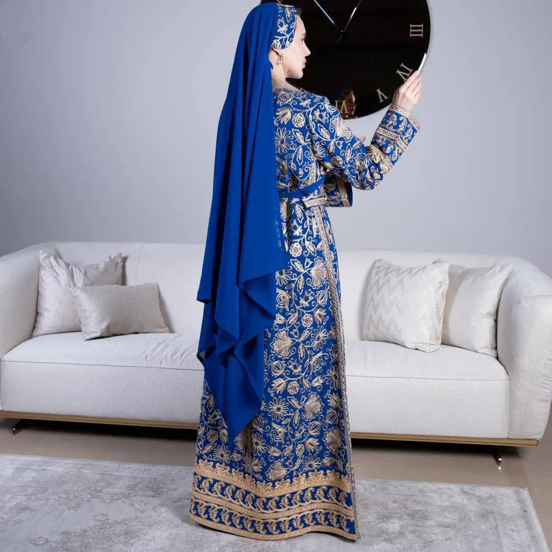 Palestinian Elegance traditional embroidered kaftan in blue and gold with intricate patterns and matching headscarf