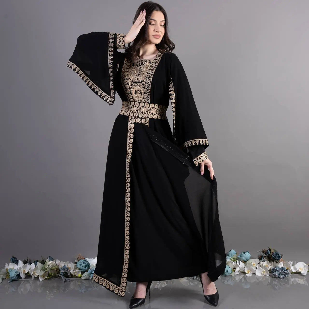 Black traditional embroidery kaftan with gold intricate patterns and wide sleeves by Palestinian Elegance