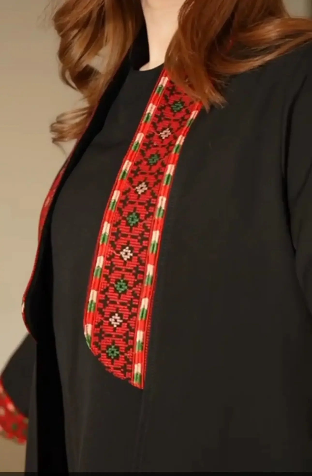 Palestinian Elegance black formal suit featuring detailed traditional embroidery suit design on the chest